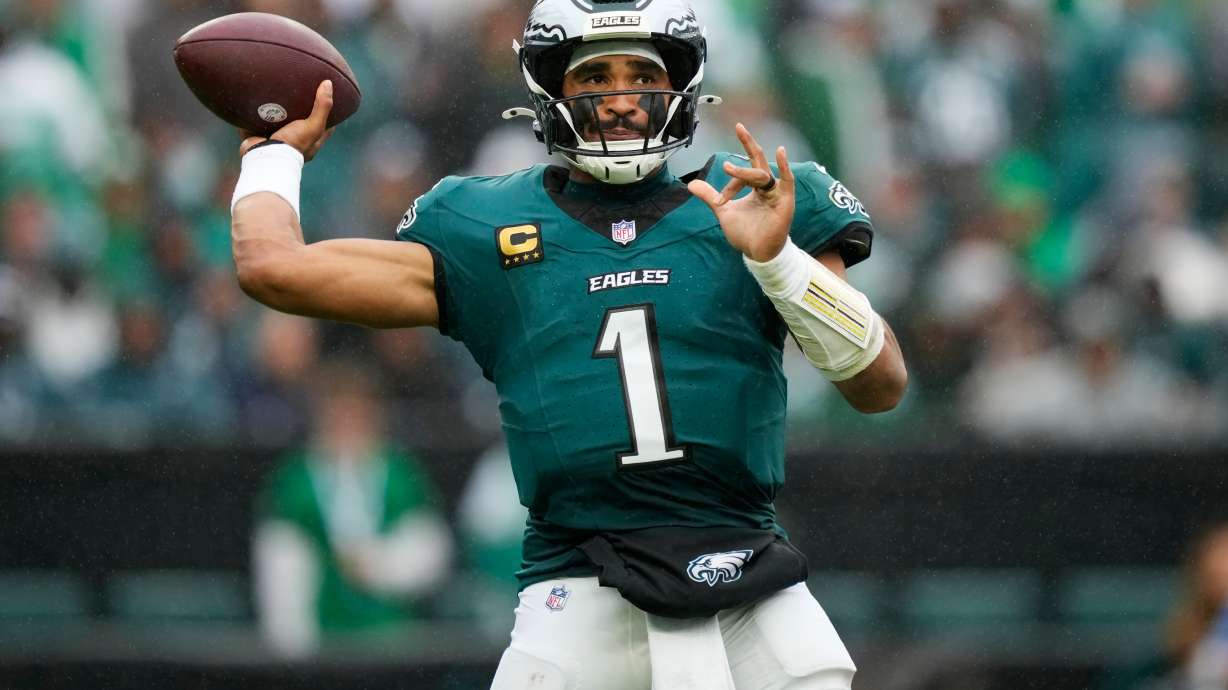 Philadelphia Eagles quarterback Jalen Hurts looks to pass during the second half of an NFL football game against the Los Angeles Rams in Philadelphia, Sunday, Oct. 4, 2026.