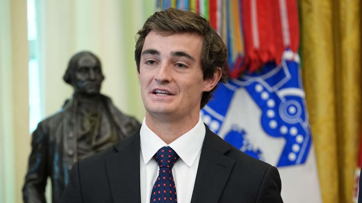 Nick Shirley speaks in the Oval Office of the White House, Tuesday, during an event with President Donald Trump in Washington. Trump cut a $10,000 check to Shirley for his help in uncovering fraud in Minnesota childcare centers.