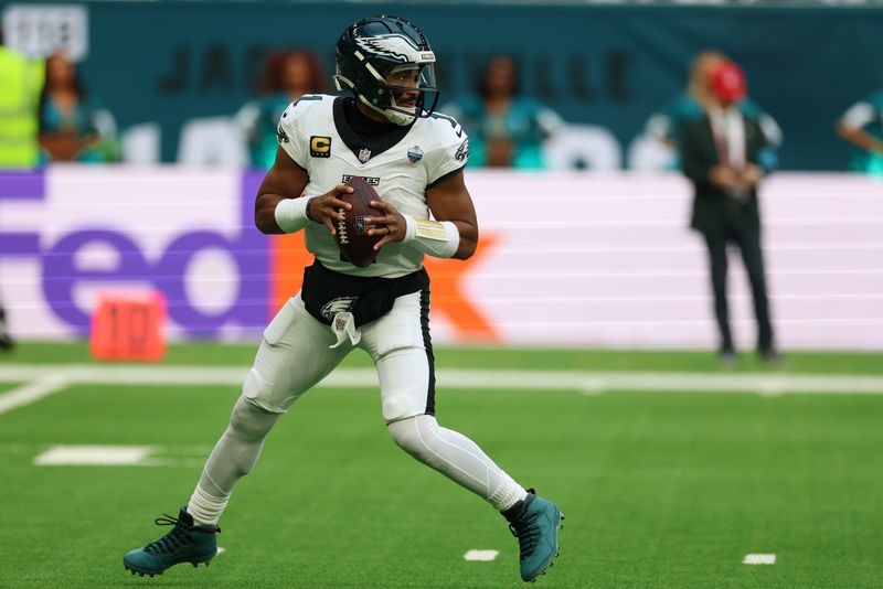 Oct 11, 2026; Tottenham, ENG;  Philadelphia Eagles quarterback Jalen Hurts (1) drops back to pass during the second half against the Jacksonville Jaguars at Tottenham Hotspur Stadium.