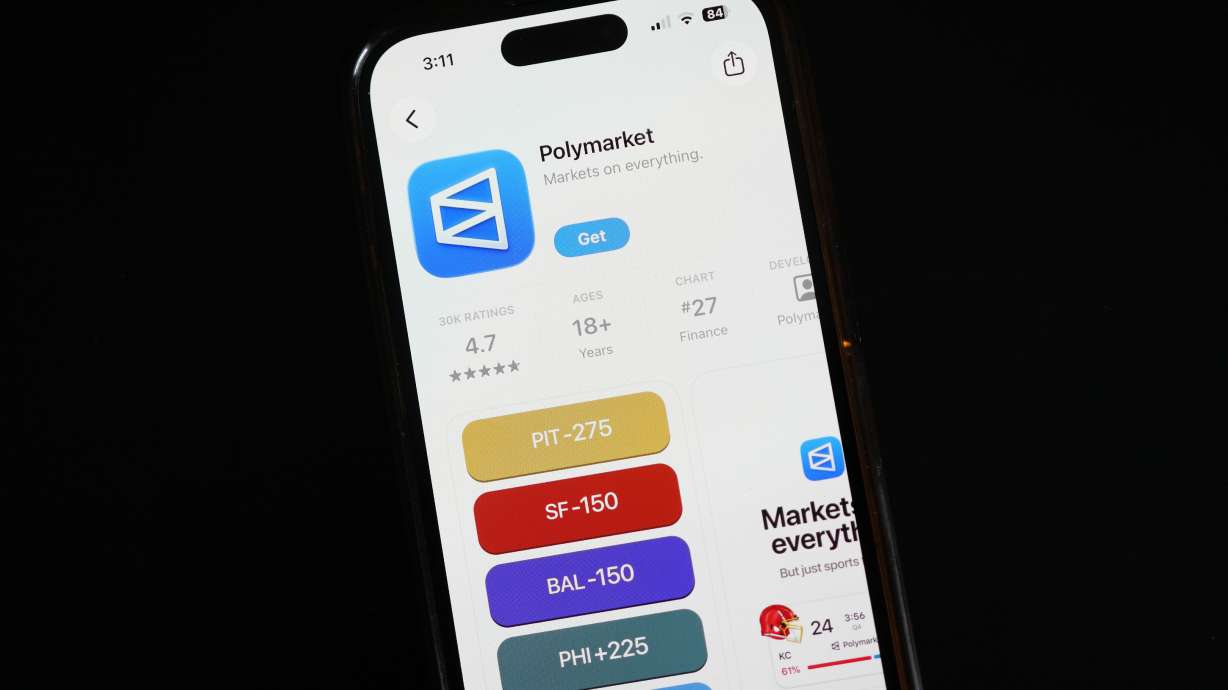 FILE - The prediction market app Polymarket is displayed on a mobile phone, April 16, 2026, in Chicago.