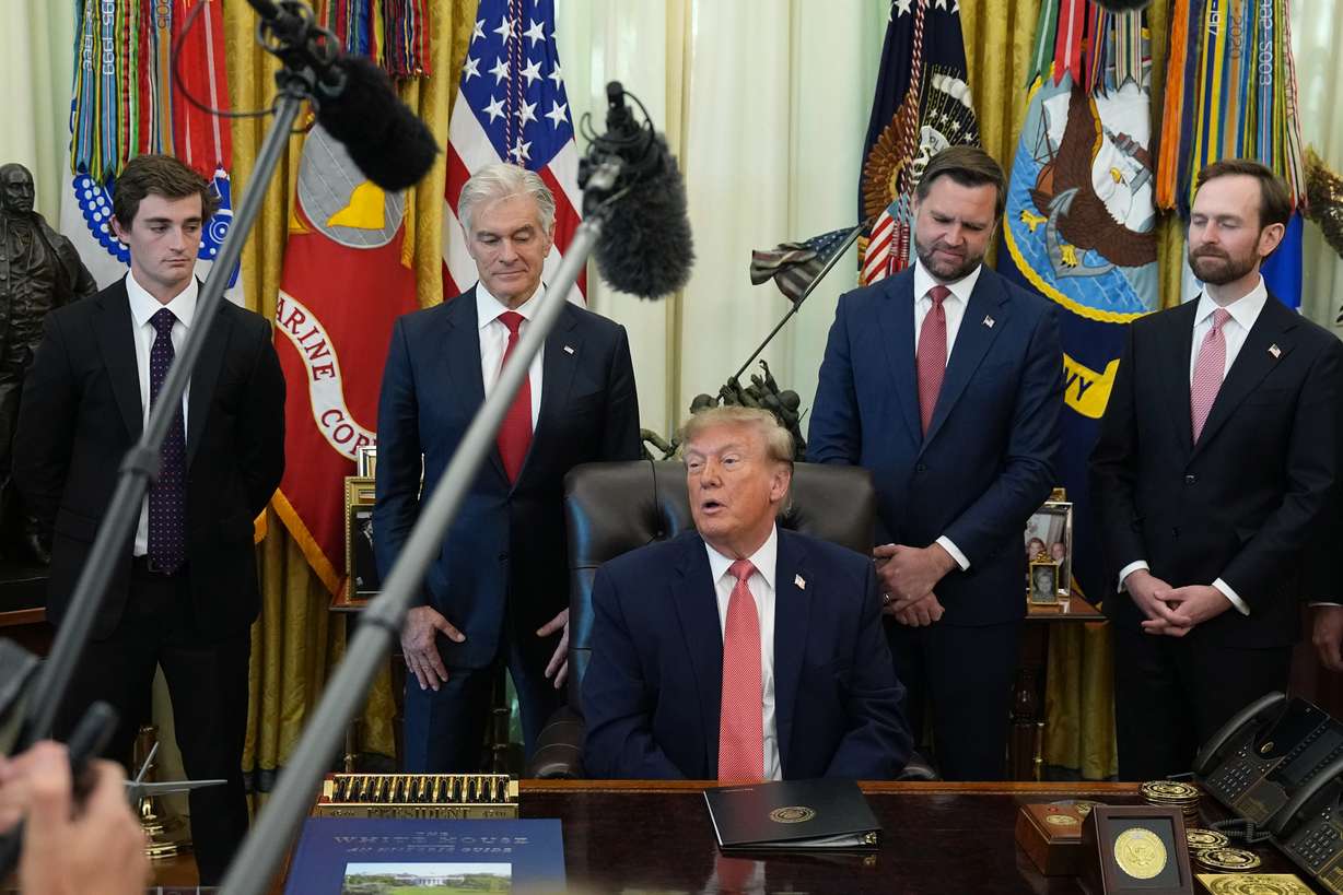 President Donald Trump speaks in the Oval Office of the White House, Tuesday, in Washington, as Nick Shirley, Centers for Medicare & Medicaid Services administrator Dr. Mehmet Oz, Vice President JD Vance and Andrew Ferguson, chairman of the Federal Trade Commission, listen. Shirley received $10,000 for helping uncover fraud in Minnesota childcare centers.