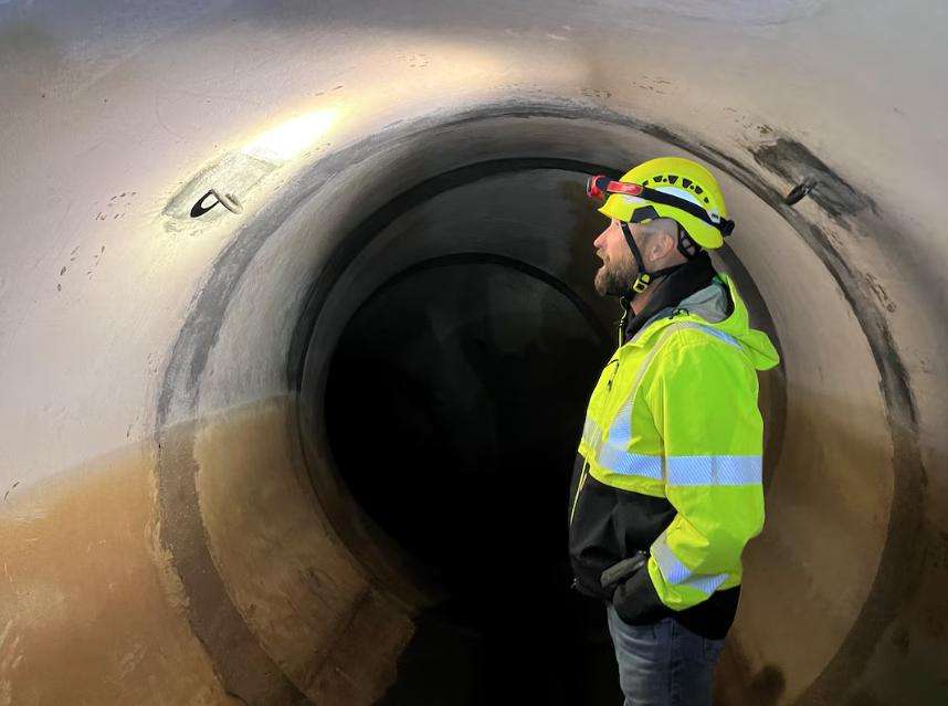 Dylan Dastrup, Stillwater area manager with the Central Utah Water Conservancy District, inspects the Stillwater Tunnel on Oct. 3, 2025.