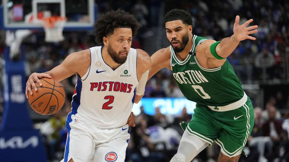 Detroit Pistons guard Cade Cunningham (2) drives on Boston Celtics forward Jayson Tatum (0) in the second half of an NBA basketball game in Detroit, Tuesday, Oct. 20, 2026.
