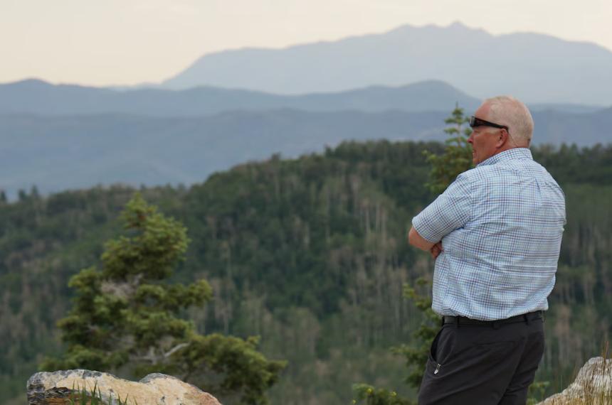 Jared Hansen, manager of the Central Utah Project, looks out at the divide between the Great Basin and the Colorado River Basin in the Wasatch Mountains on July 1.
