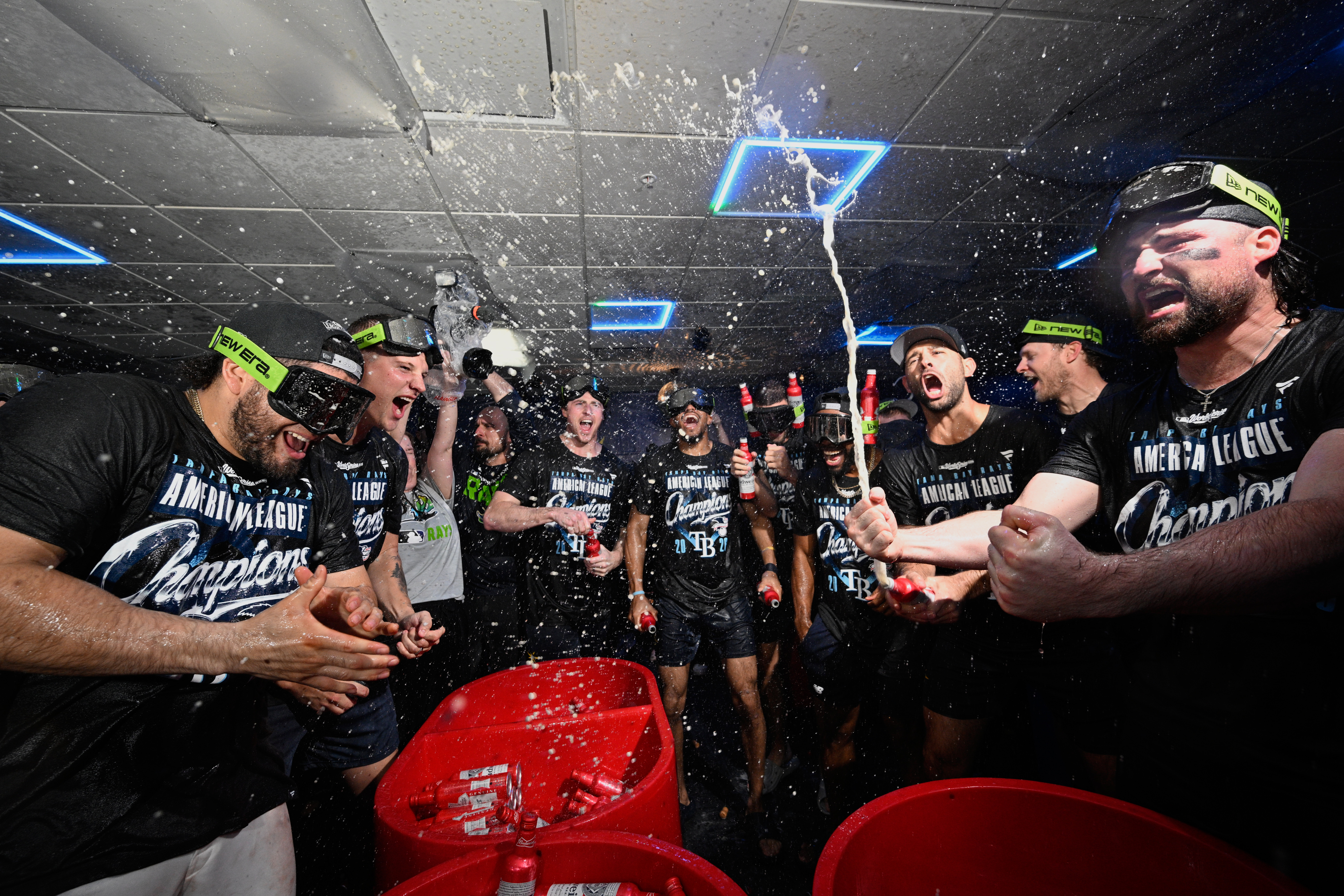 The Tampa Bay Rays celebrate their win in the locker room against the Cleveland Guardians in Game 6 of an American League Championship Series baseball game in St. Petersburg, Fla. Monday, Oct. 19, 2026.