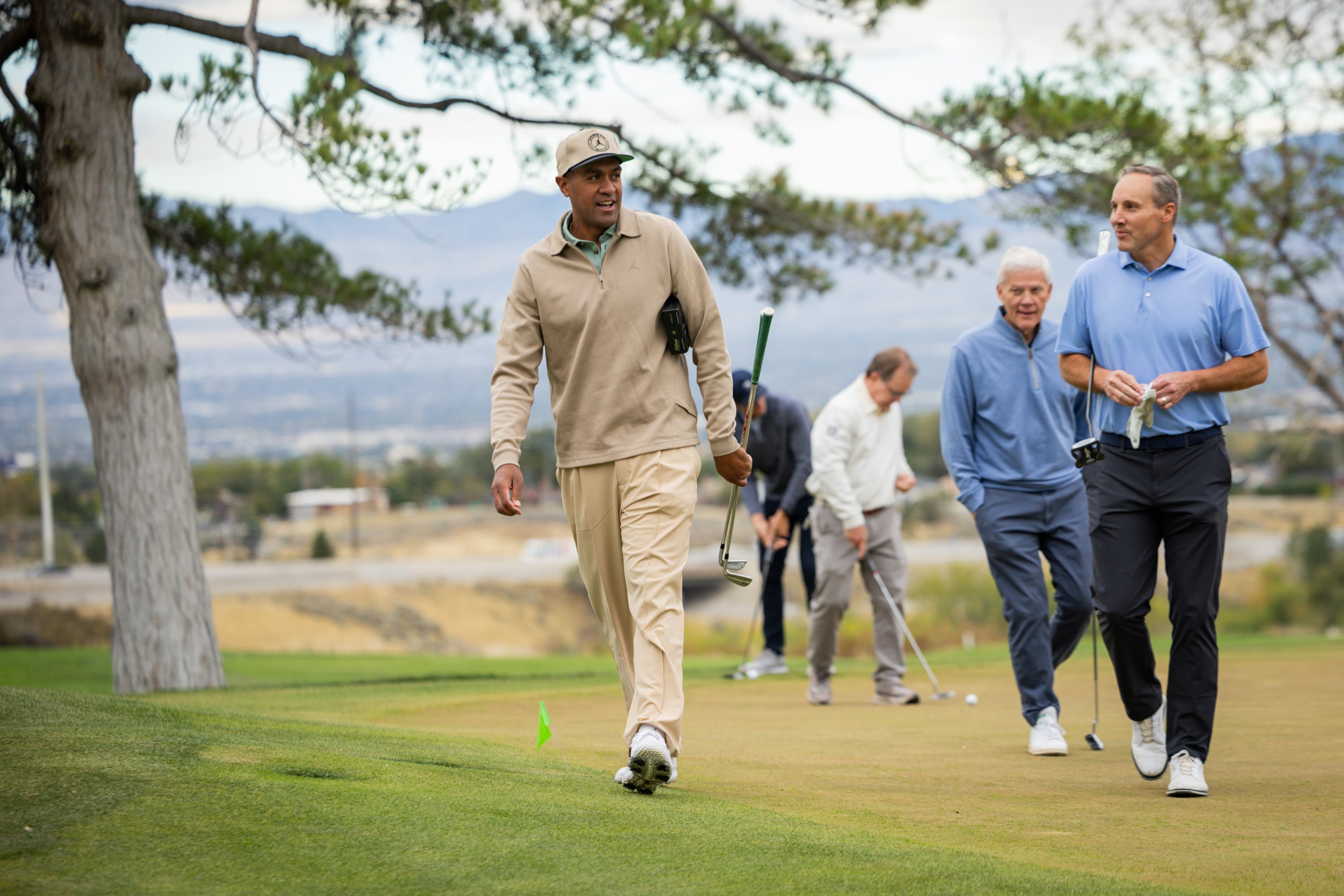 Tony Finau, left, golfs with community leaders in the "Readers Cup,” a golf event sponsored by Tony Finau and community leaders advocating for early literacy at The Country Club in Salt Lake City on Tuesday.