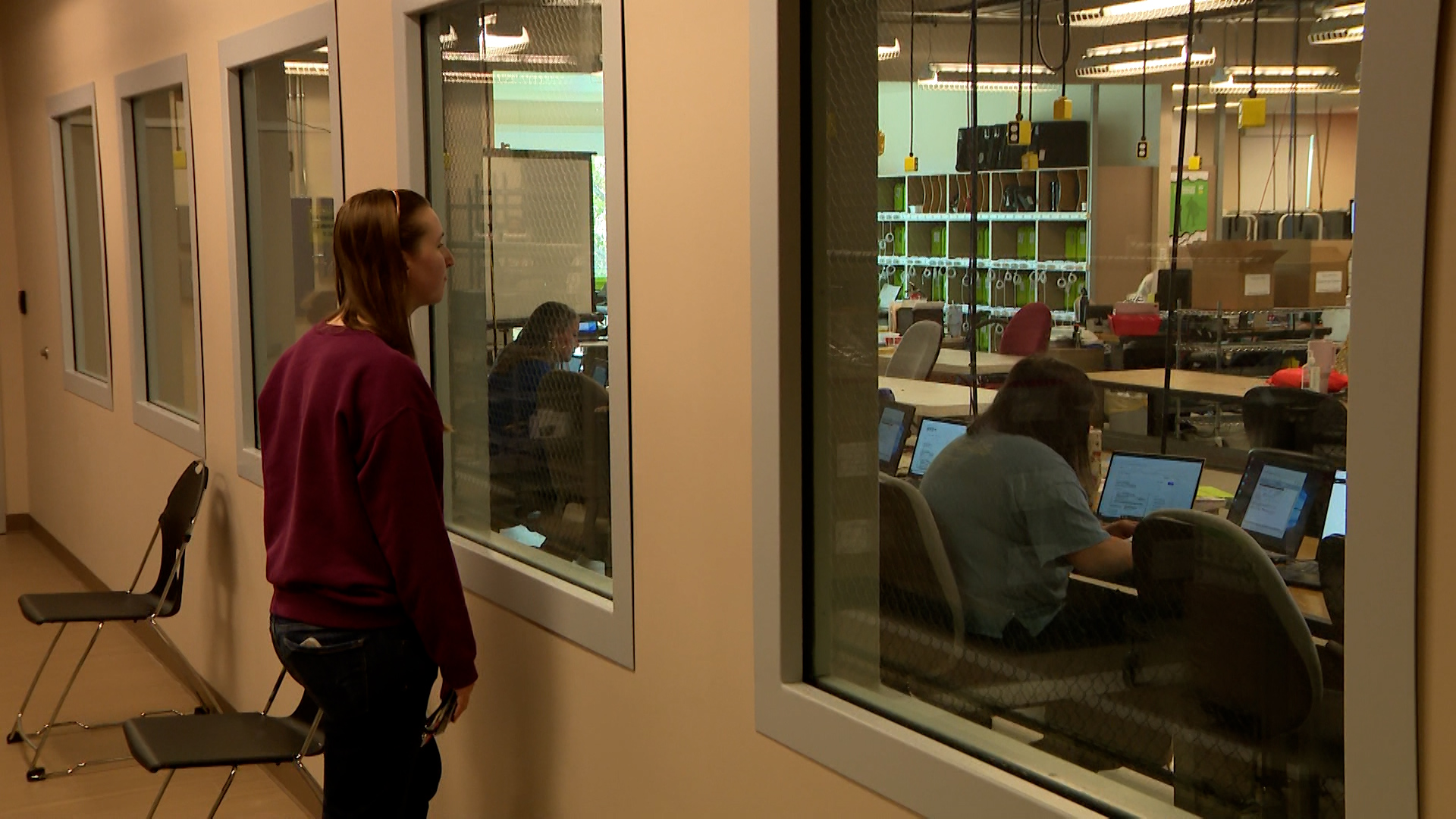 Large windows allow the public to watch elections workers process ballots.