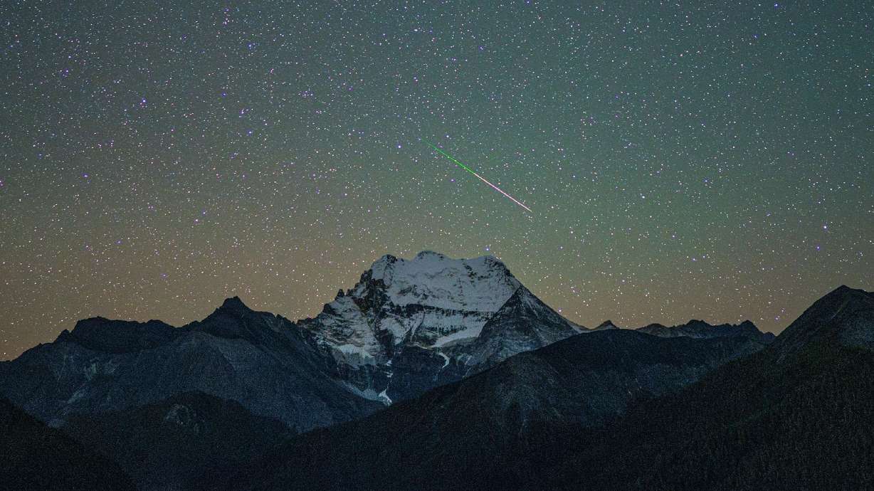 The Orionid meteor shower over the Yading Nature Reserve in southwest China's Sichuan province in October 2025. This year's meteor shower may be overshadowed by a bright moon.