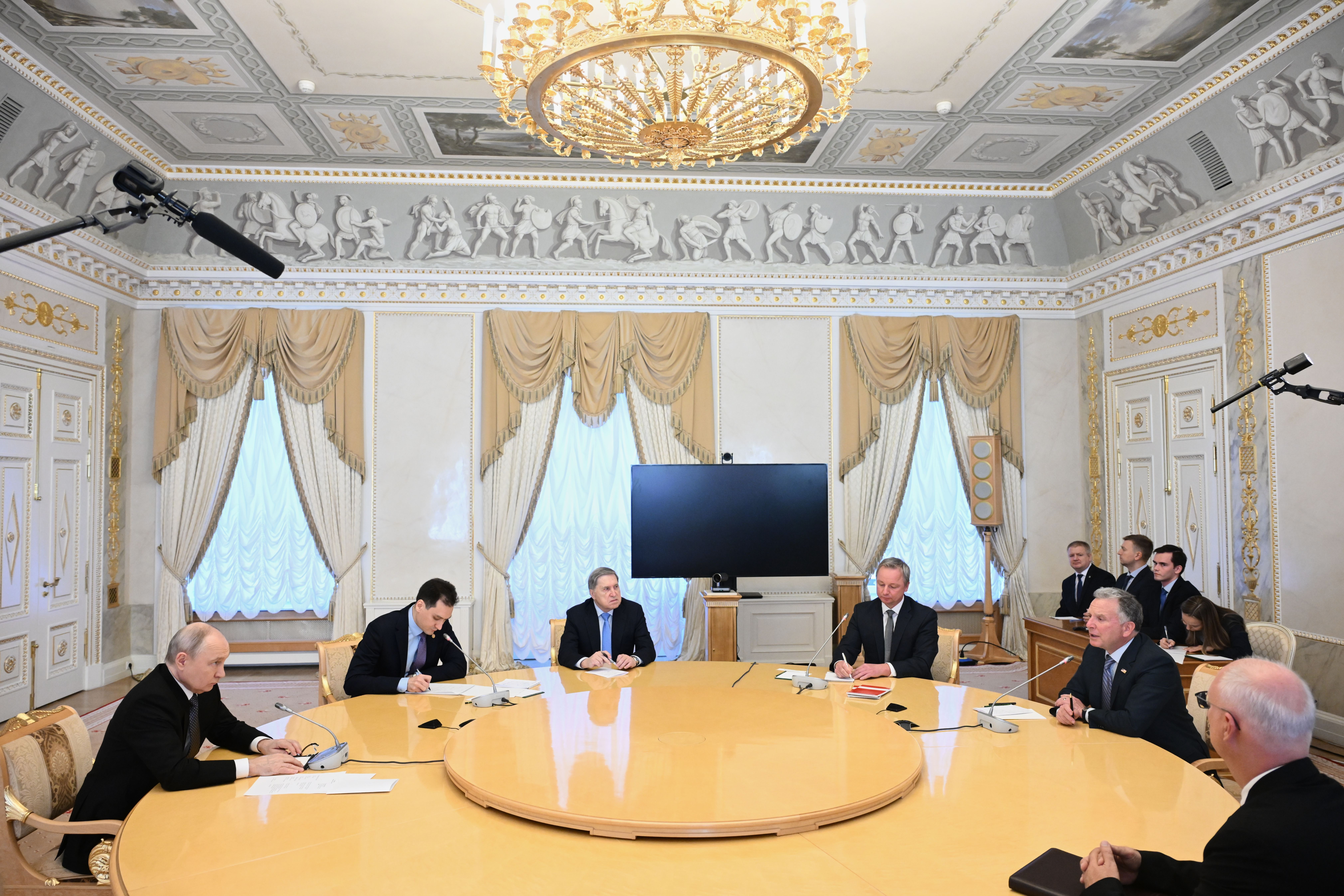 Russian President Vladimir Putin and President Donald Trump's special envoy Steve Witkoff with Russian presidential envoy Kirill Dmitriev and Kremlin foreign policy adviser Yuri Ushakov at the Konstantin Palace in Strelnya, outside St. Petersburg, Russia, on Wednesday. Putin agreed to resume trilateral peace talks after Nov. 10.