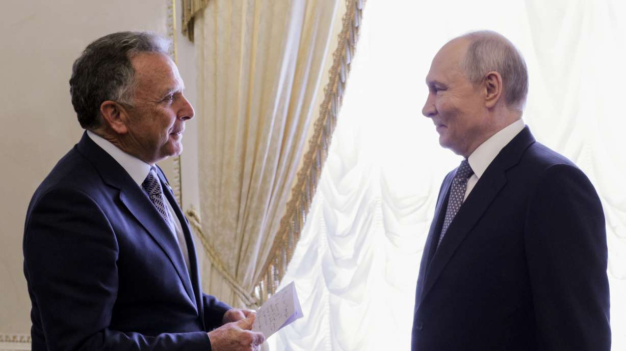 President Donald Trump's special envoy Steve Witkoff holds a paper while speaking to Russian President Vladimir Putin at the Konstantin Palace in Strelnya, outside St. Petersburg, Russia, on Wednesday.
