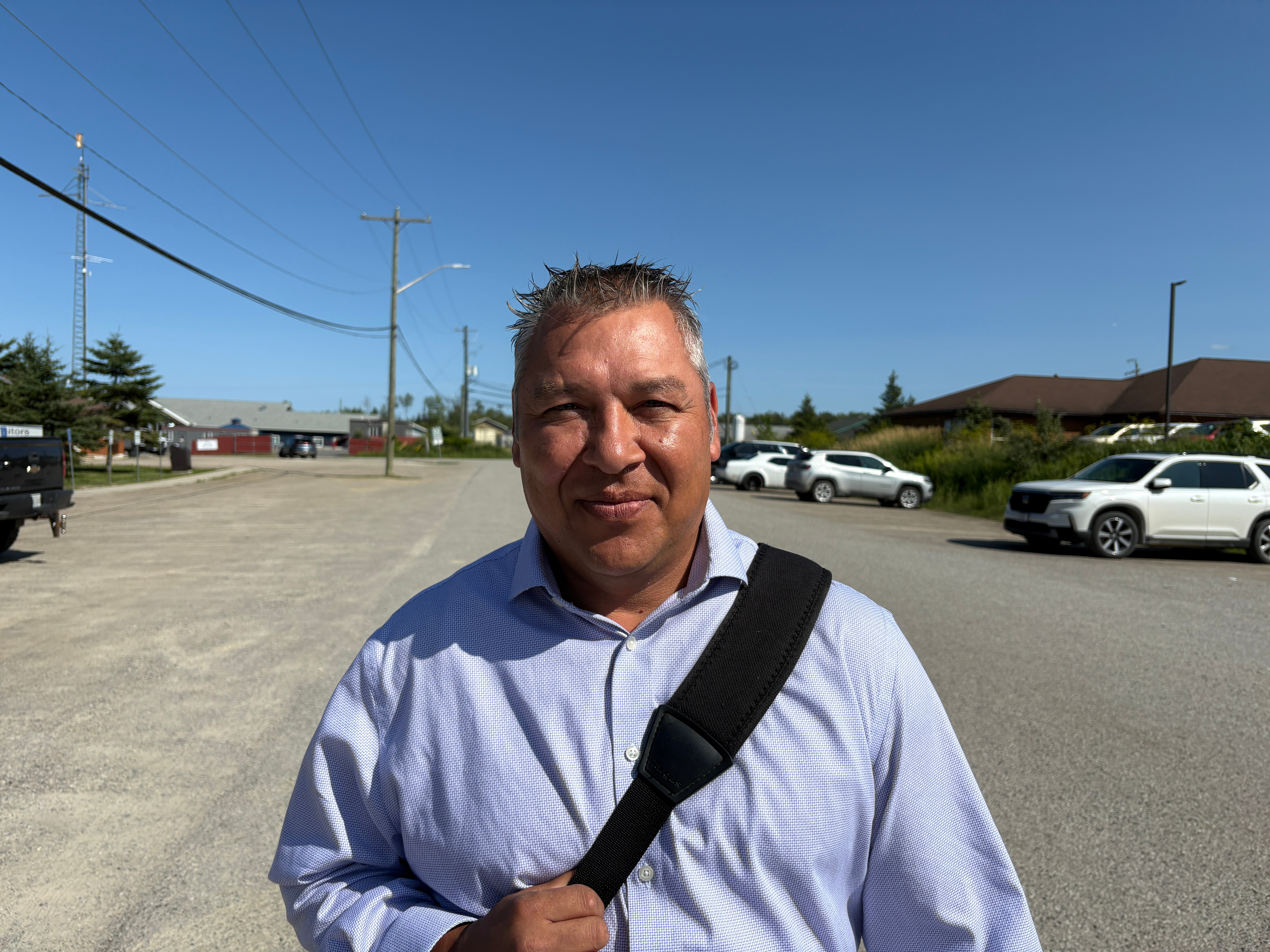 Chief Tim Ominika stands on a street in Wiikwemkoong, Ontario, Canada, July 22.