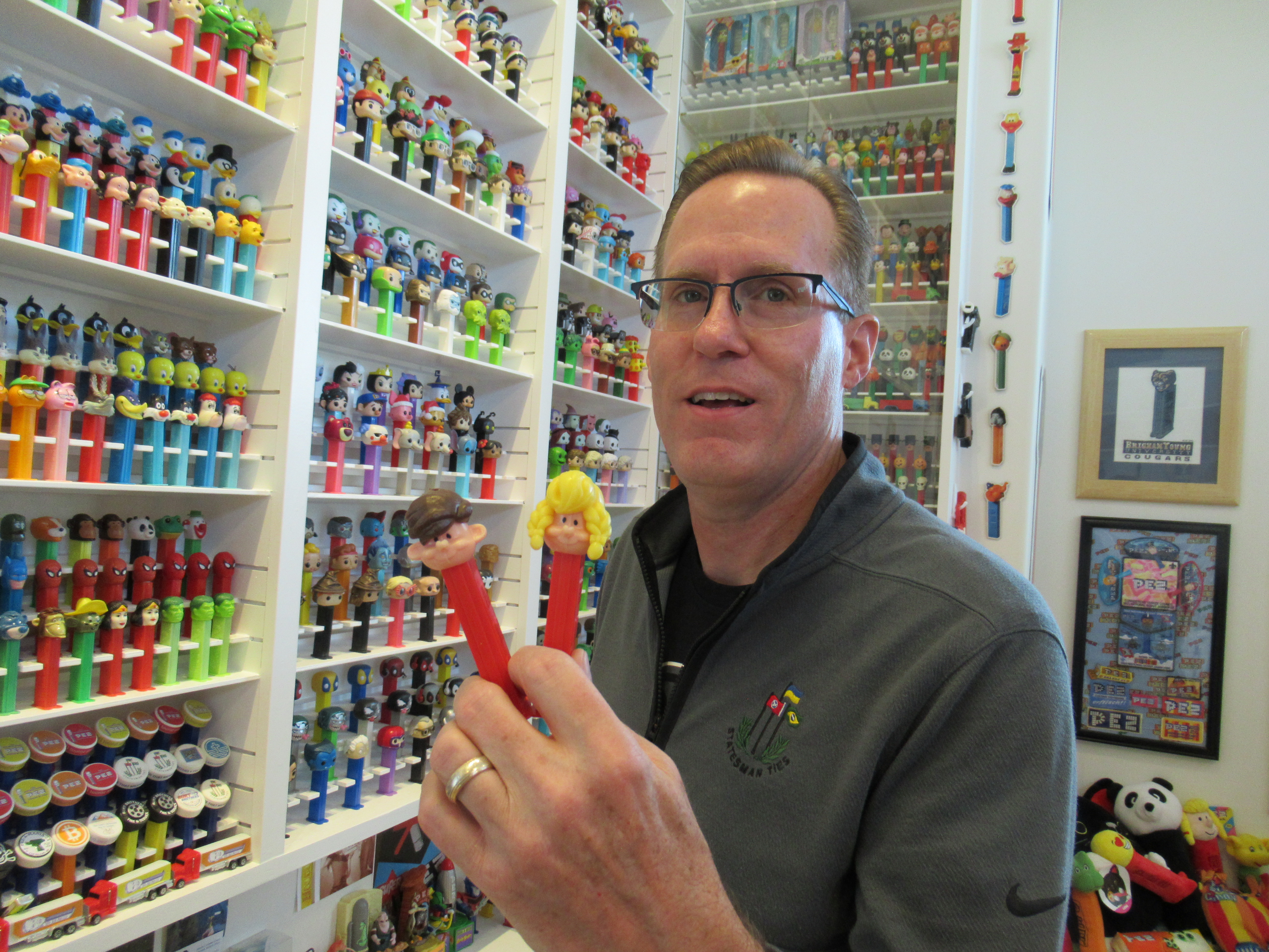 Brent Beezer shows the two Pez dispensers given to him by his wife on Valentine's Day in 1996.