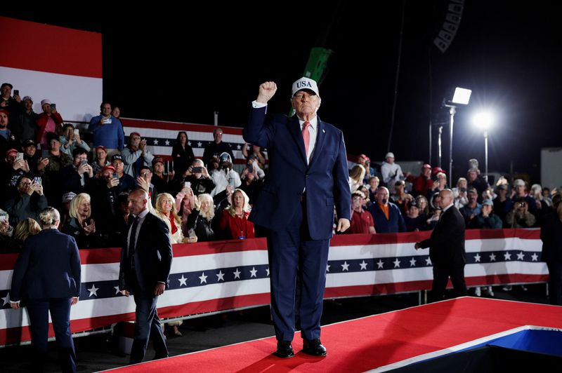 President Donald Trump gestures during a campaign rally at Pitt-Greenville Airport in Greenville, N.C., Tuesday. Trump urged supporters to vote, signaling how much is at stake in the state.