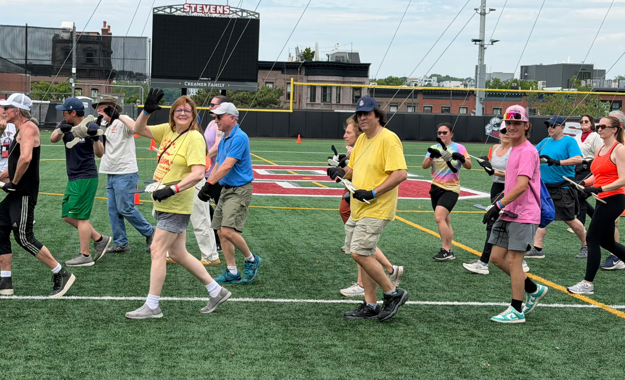 Alex Harris (in pink) walks with 90 other balloon handlers in October in New Jersey as they train for the 100th Macy's Thanksgiving Day Parade.