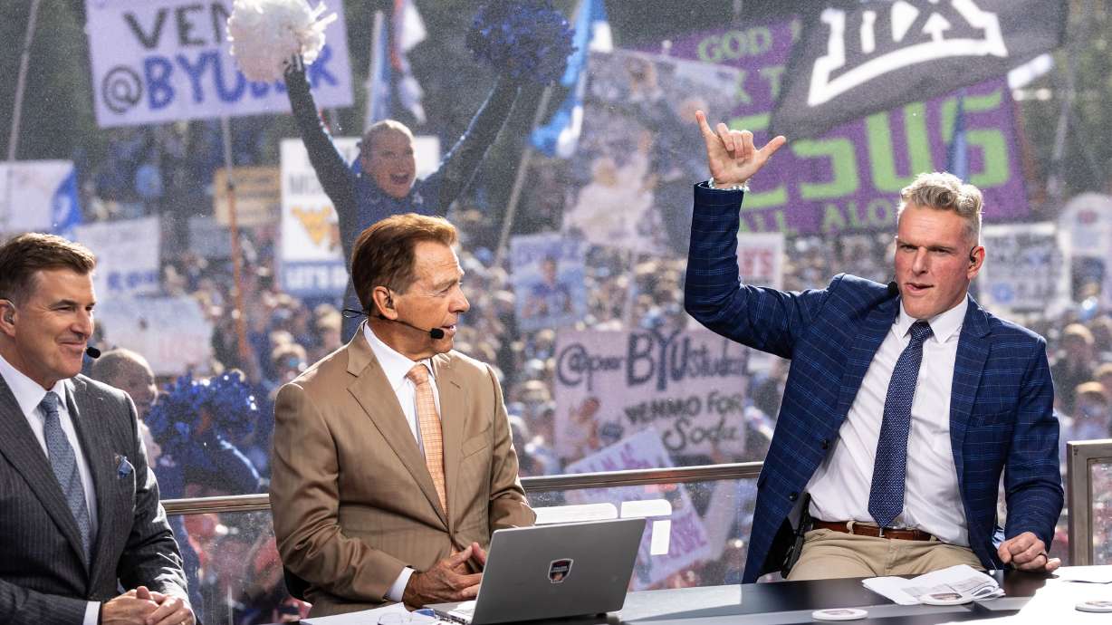 Pat McAfee holds up a “Y” during the ESPN “College GameDay” show near Heritage Halls on the BYU campus in Provo on Saturday.
