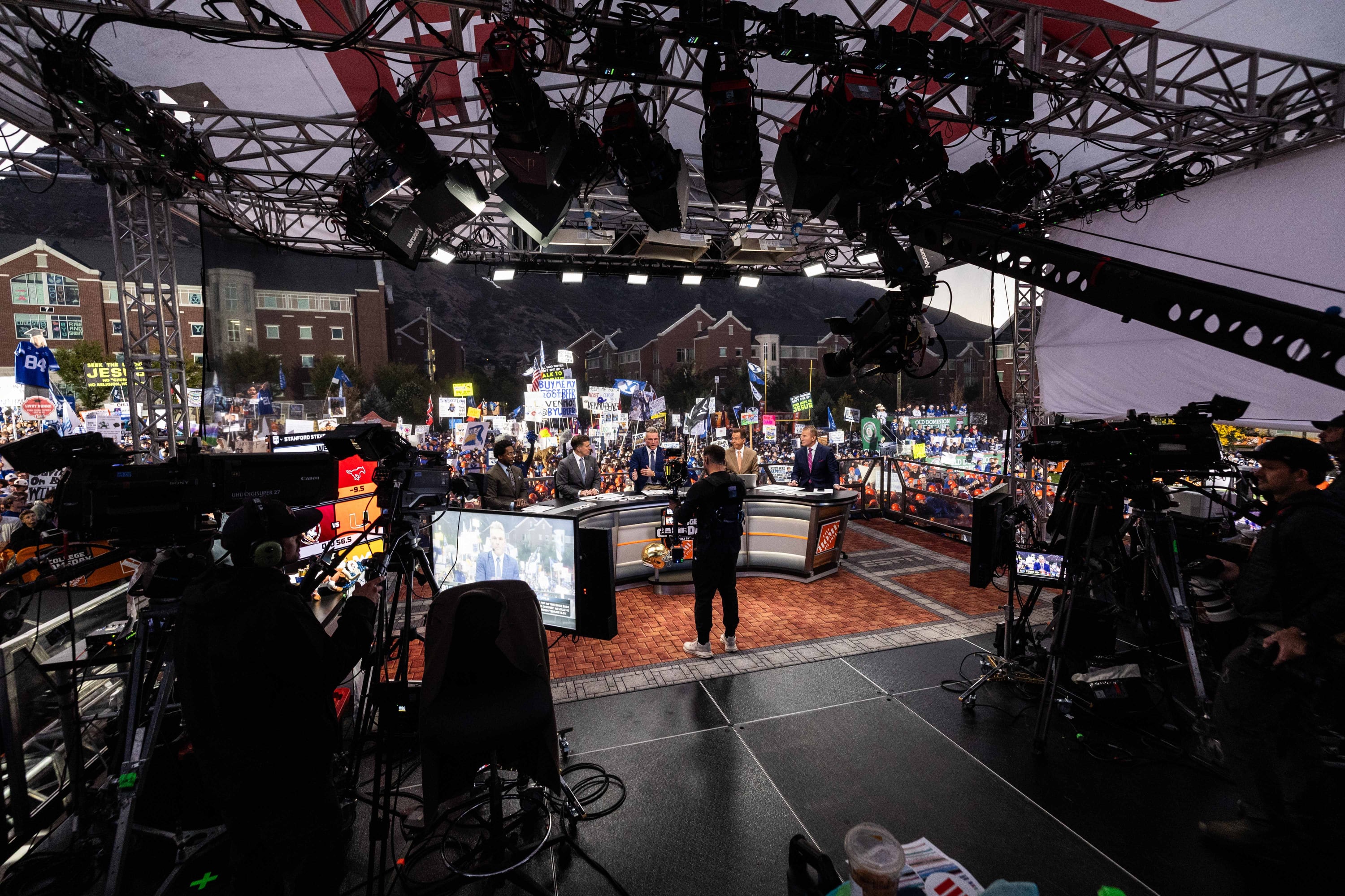 Desmond Howard, Rece Davis, Pat McAfee, Nick Saban, and Kirk Herbstreit speak to one another during the ESPN “College GameDay” show near Heritage Halls on the BYU campus in Provo on Saturday.