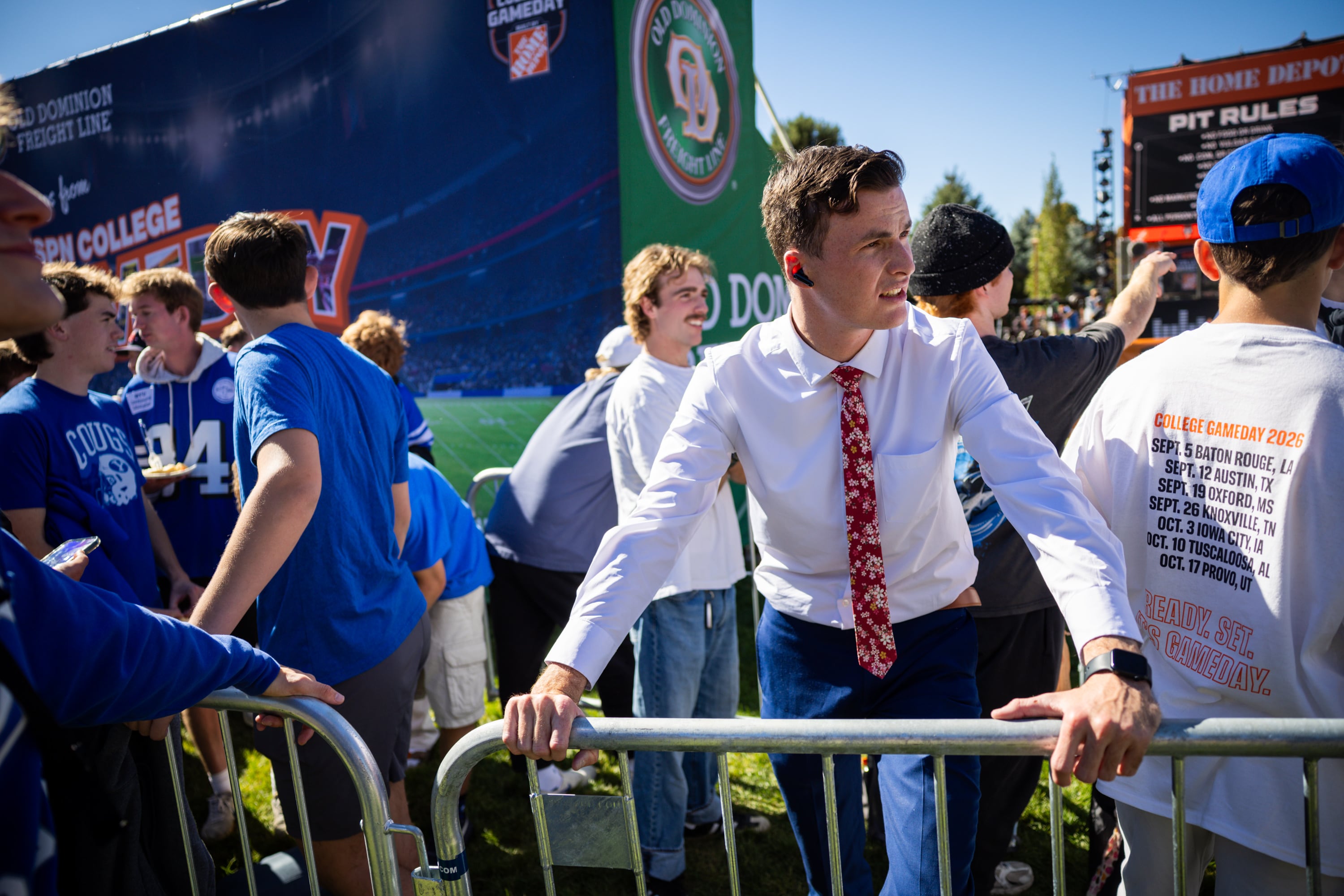 BYU student Trevor Wach, 23, center, waits in line with fellow students for a spot to watch ESPN’s “College GameDay” on the lawn at Heritage Halls on the BYU campus in Provo on Friday.