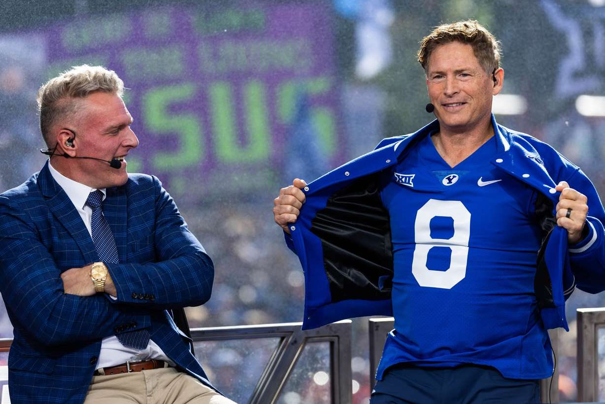 Steve Young reveals his BYU jersey under his letterman jacket during the ESPN “College GameDay” show near Heritage Halls on the BYU campus in Provo on Saturday.