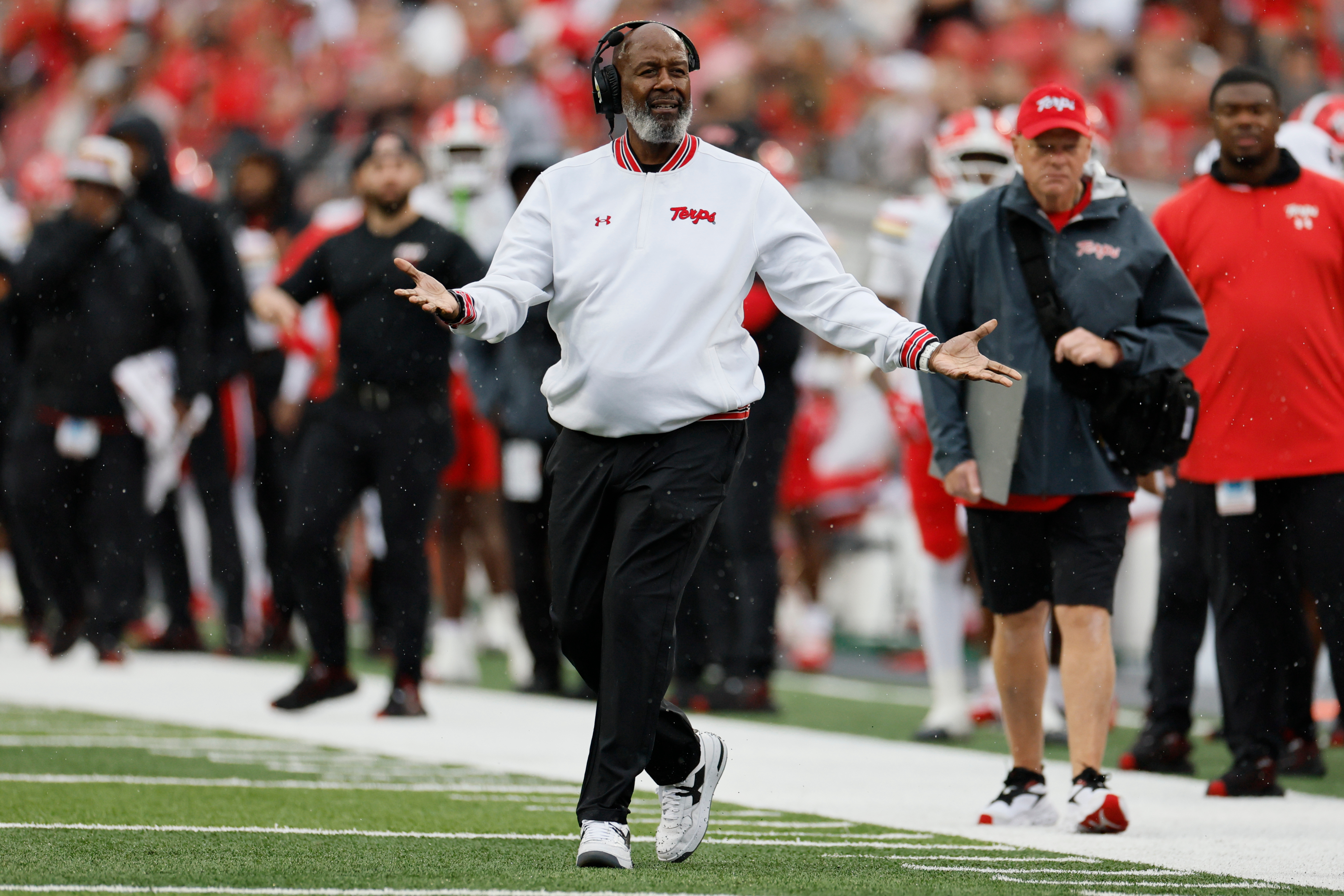 Maryland head coach Michael Locksley, center, reacts to a referee's call during the first half of an NCAA college football game against Ohio State, Saturday, Oct. 10, 2026, in Columbus, Ohio. 