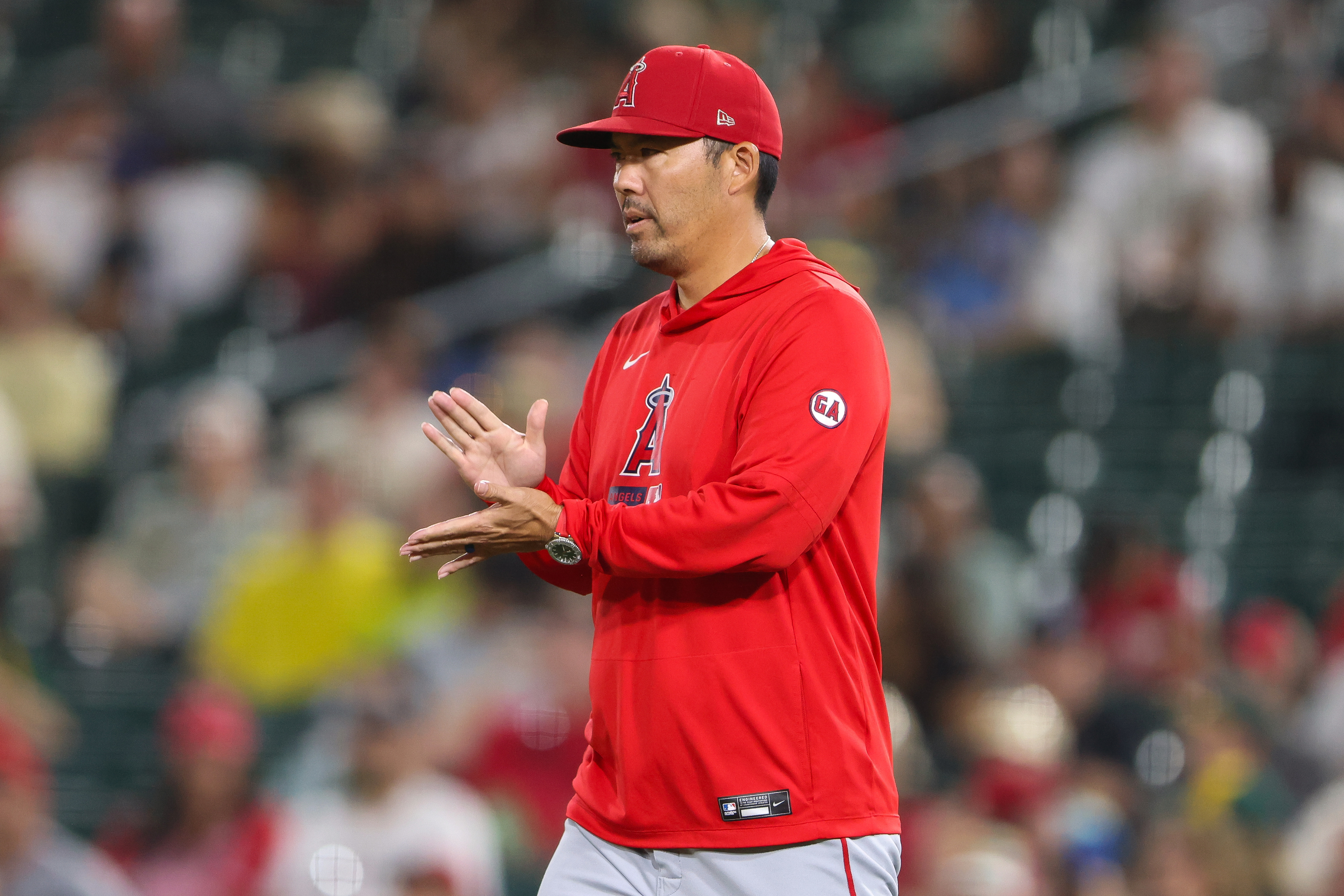 Los Angeles Angels manager Kurt Suzuki walks to the mound as he makes a pitching change during the fifth inning of a baseball game against the Athletics Wednesday, Sept. 23, 2026, in West Sacramento, Calif. 