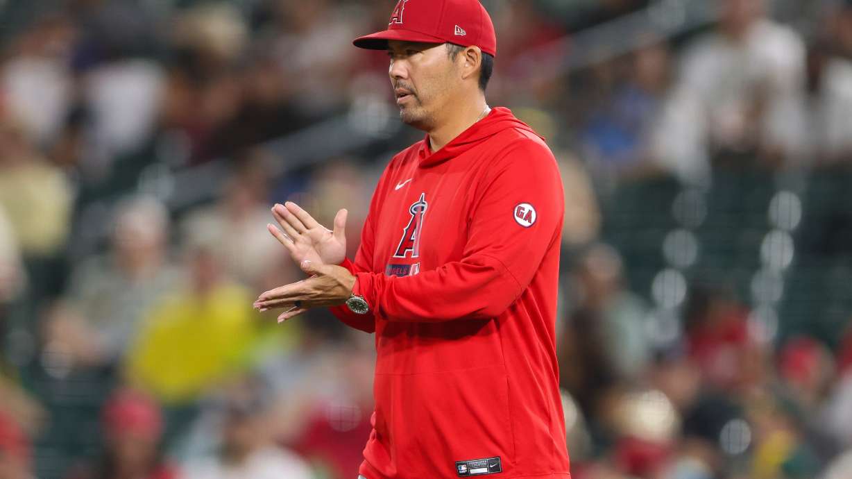 Los Angeles Angels manager Kurt Suzuki walks to the mound as he makes a pitching change during the fifth inning of a baseball game against the Athletics Wednesday, Sept. 23, 2026, in West Sacramento, Calif.