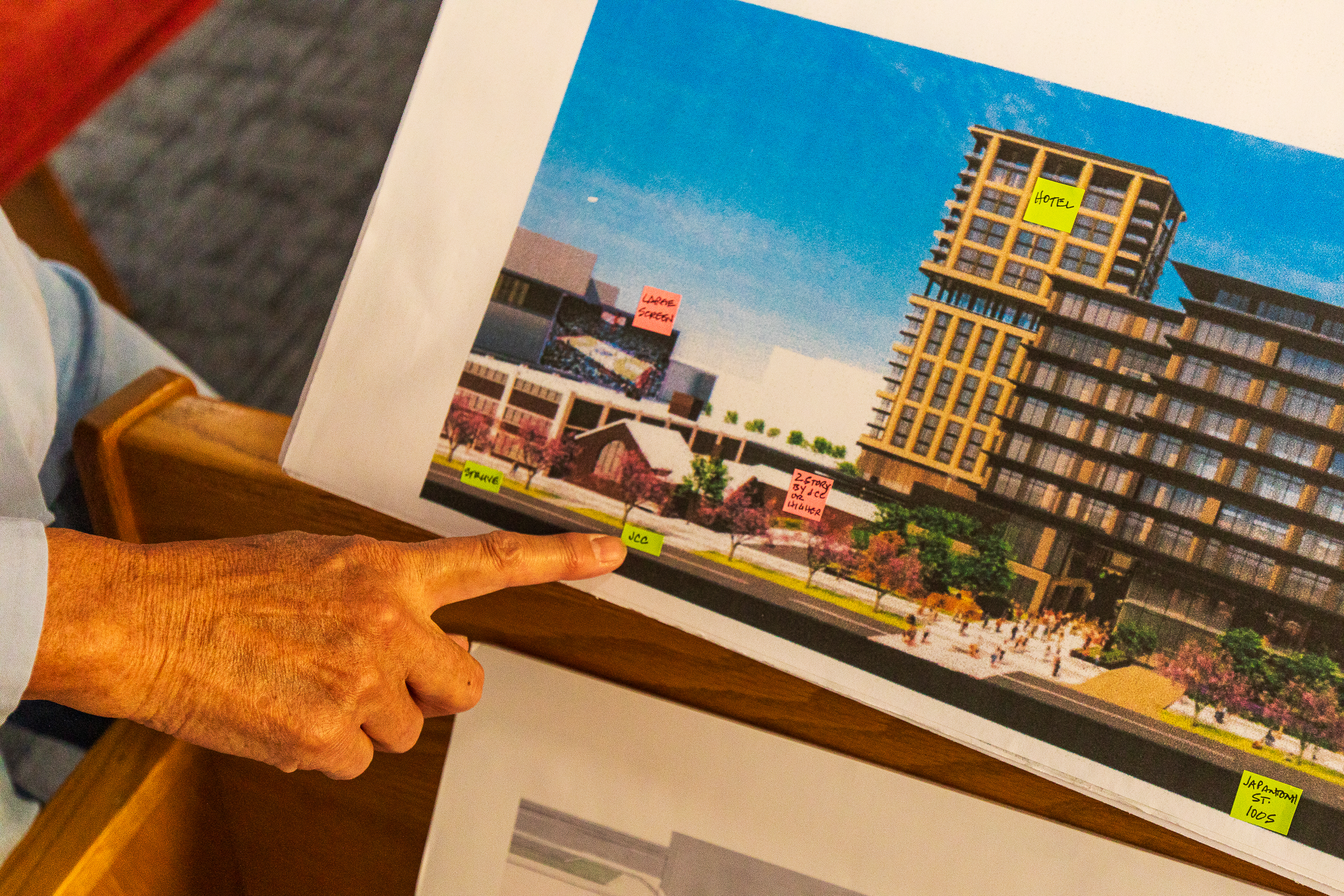 Lynne Ward, an elder at the Japanese Church of Christ, points to where the church is located in the context of Smith Entertainment Group's downtown plans.