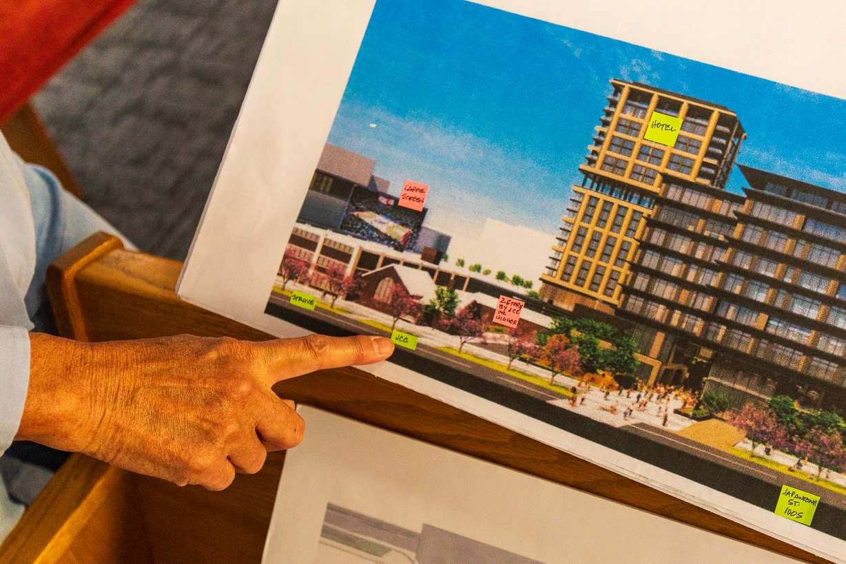 Lynne Ward, an elder at the Japanese Church of Christ, points to where the church is located in the context of Smith Entertainment Group's downtown plans.