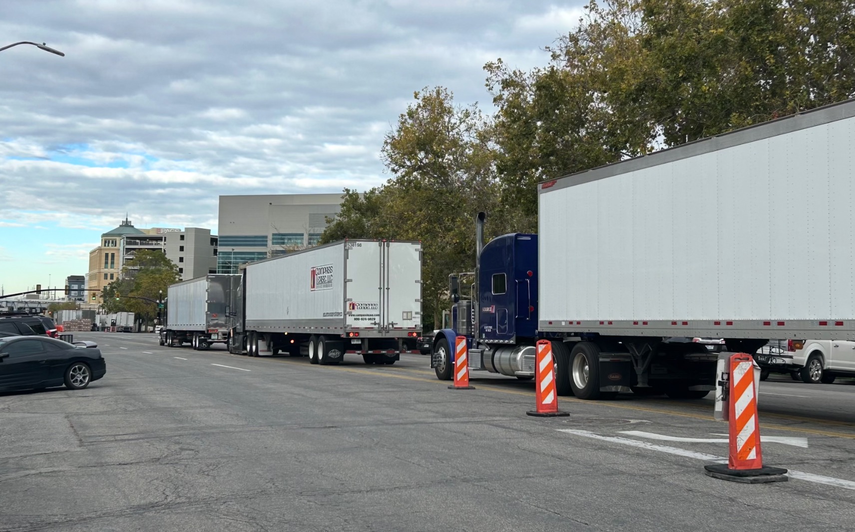 Semitrucks with gear for a Delta Center line 100 South outside of the Japanese Church of Christ on Tuesday. Church leaders are concerned that a new venue proposed in the area will add truck traffic on 100 South/Japantown Street.