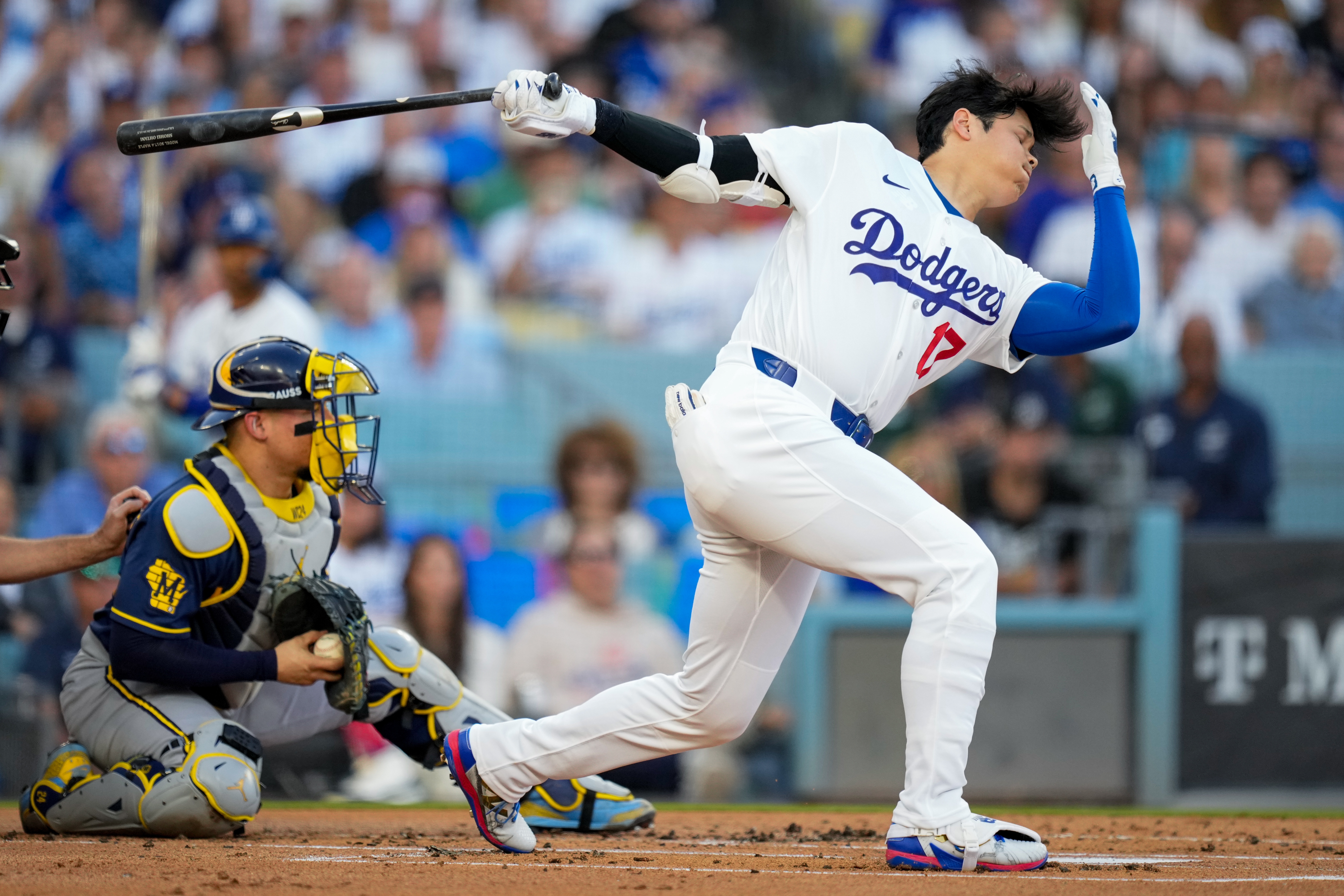 Los Angeles Dodgers designated hitter Shohei Ohtani strikes out as Milwaukee Brewers catcher William Contreras catches the ball during the first inning of Game 4 of baseball's National League Championship Series between the Milwaukee Brewers and the Los Angeles Dodgers, Thursday, Oct. 15, 2026, in Los Angeles. 