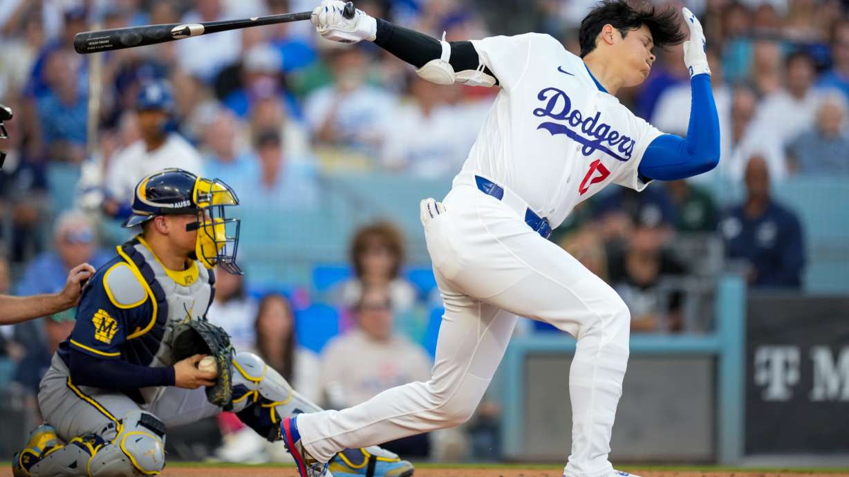 Los Angeles Dodgers designated hitter Shohei Ohtani strikes out as Milwaukee Brewers catcher William Contreras catches the ball during the first inning of Game 4 of baseball's National League Championship Series between the Milwaukee Brewers and the Los Angeles Dodgers, Thursday, Oct. 15, 2026, in Los Angeles.