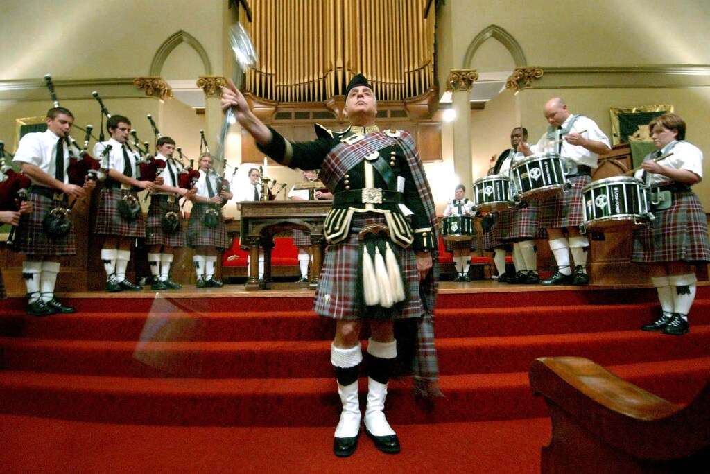 Drummer Major, Jack Marinello, twirls his mace while performing with the Utah Power Salt Lake Scots during celebration of "Kirkin 'O'th 'Tartan" on Sunday, Oct. 31, 2004. The First Presbyterian Church celebrates once a year on Reformation Sunday, which is the last Sunday in October.