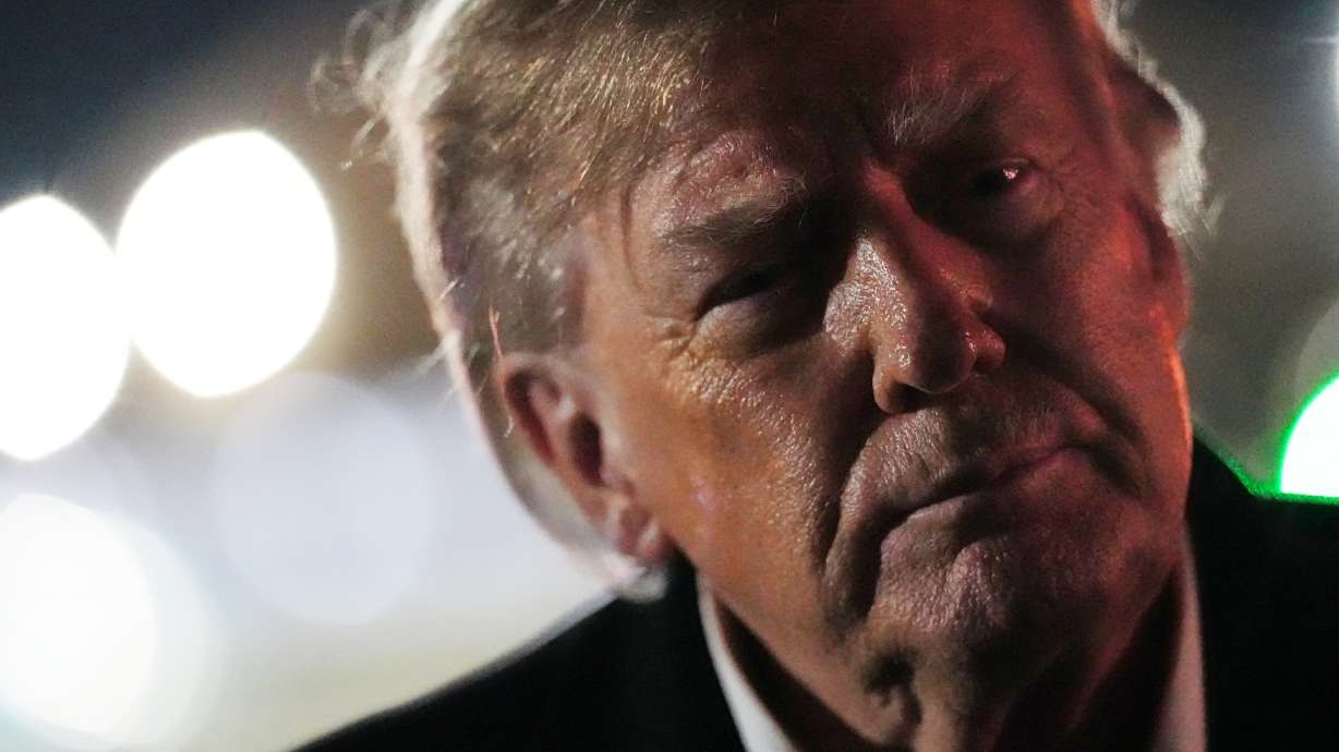 President Donald Trump speaks to reporters after arriving on Air Force One, Wednesday, at Joint Base Andrews, Md. A federal judge ordered Trump on Thursday to sit for a deposition in his defamation lawsuit against the BBC by Dec. 11.