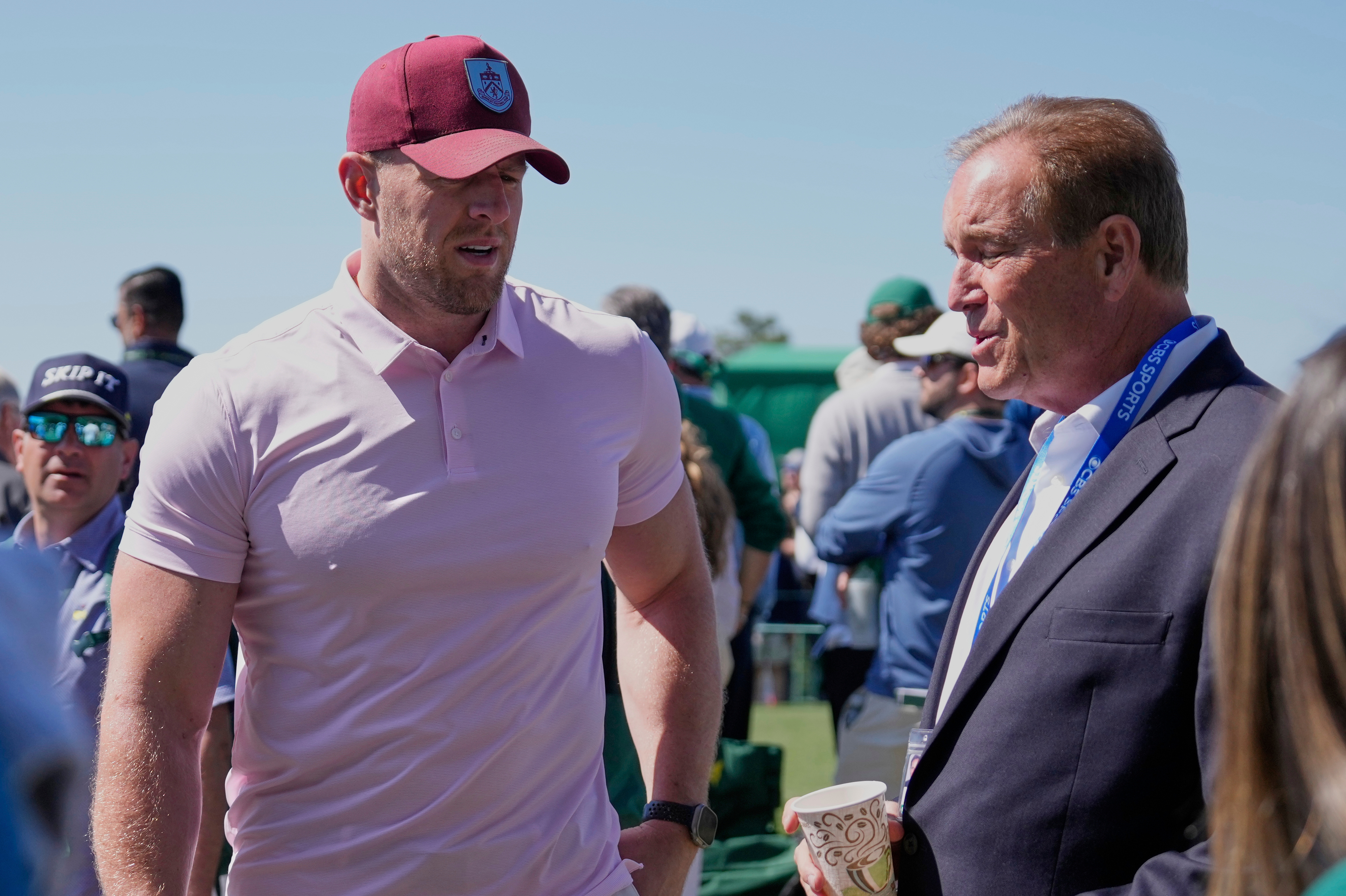 FILE - Former NFL player J.J. Watt, left, talks with sportscaster Jim Nantz during the final round at the Masters golf tournament, April 13, 2025, in Augusta, Ga. 