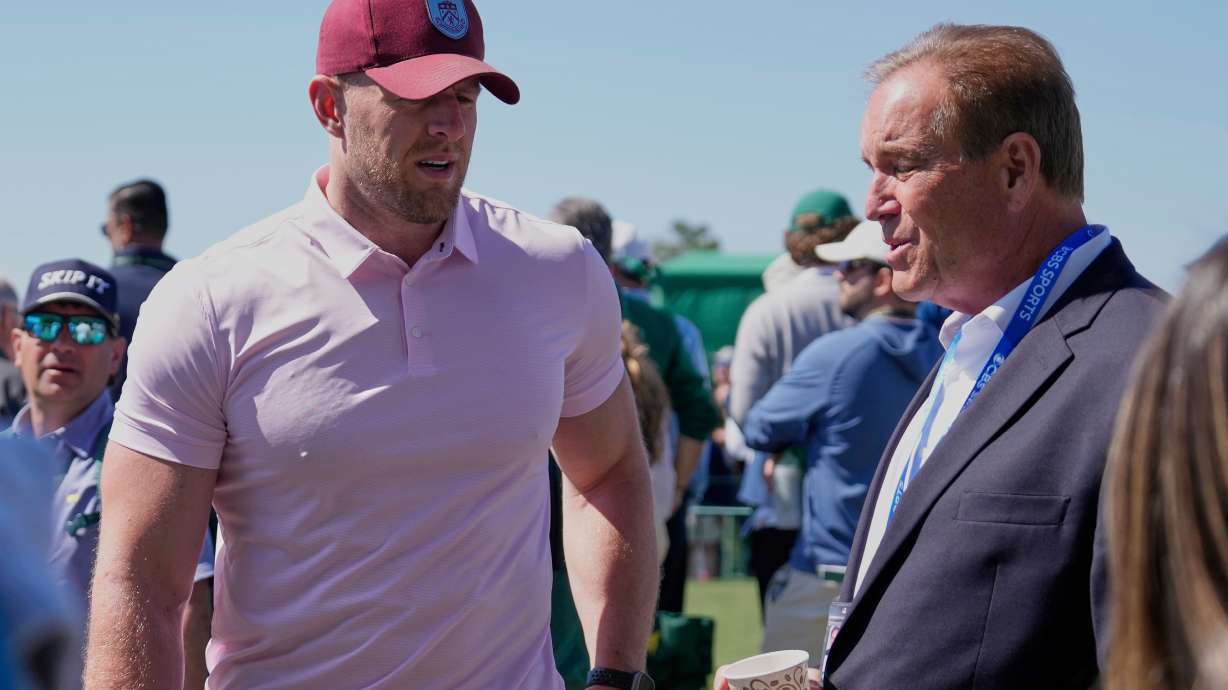 FILE - Former NFL player J.J. Watt, left, talks with sportscaster Jim Nantz during the final round at the Masters golf tournament, April 13, 2025, in Augusta, Ga.