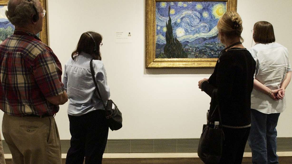 Visitors to the Museum of Fine Arts, Houston view Vincent van Gogh's painting, "The Starry Night," on Oct. 17, 2003, in Houston.