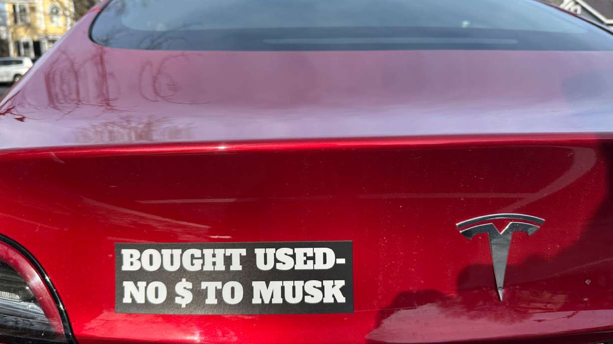 A Tesla vehicle displays a sticker referring to the car's purchase on Dec. 15, 2024, in Concord, Mass.