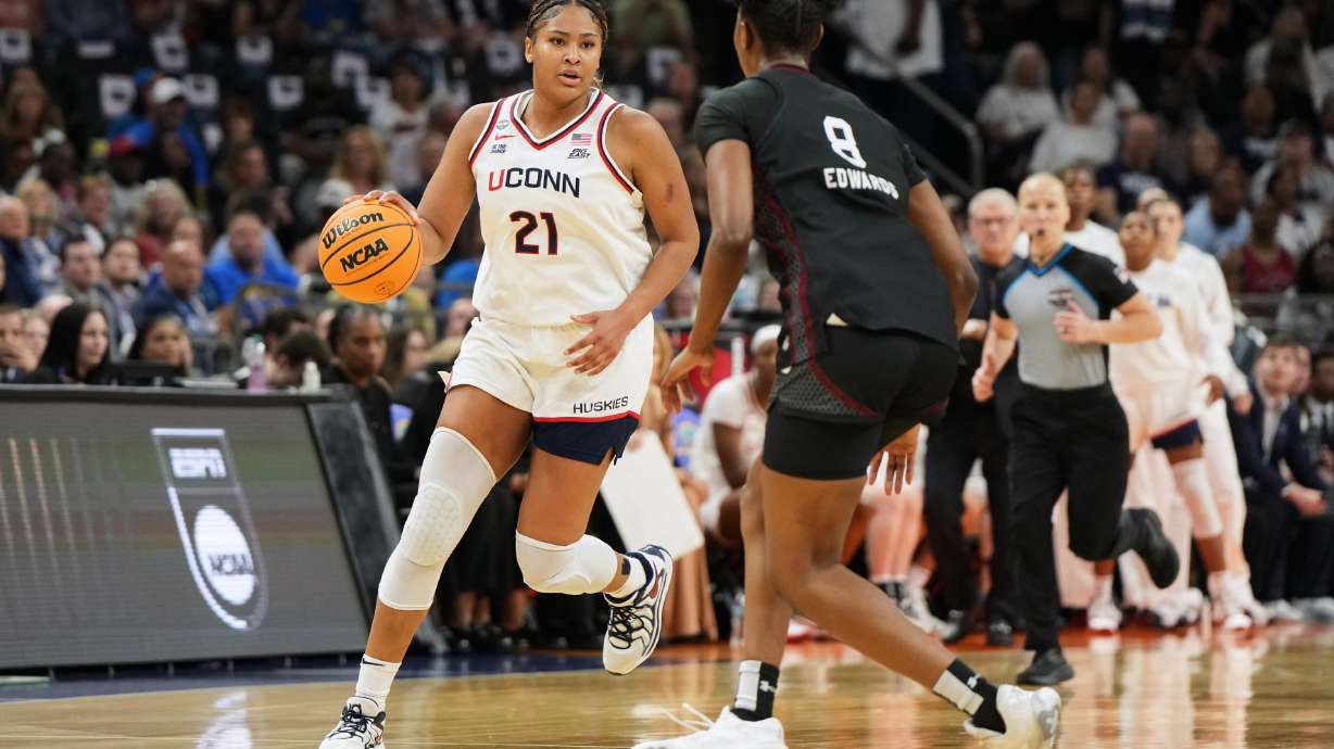 FILE - UConn forward Sarah Strong (21) works against South Carolina during the first half of a woman's NCAA college basketball tournament semifinal game at the Final Four, April 3, 2026, in Phoenix.