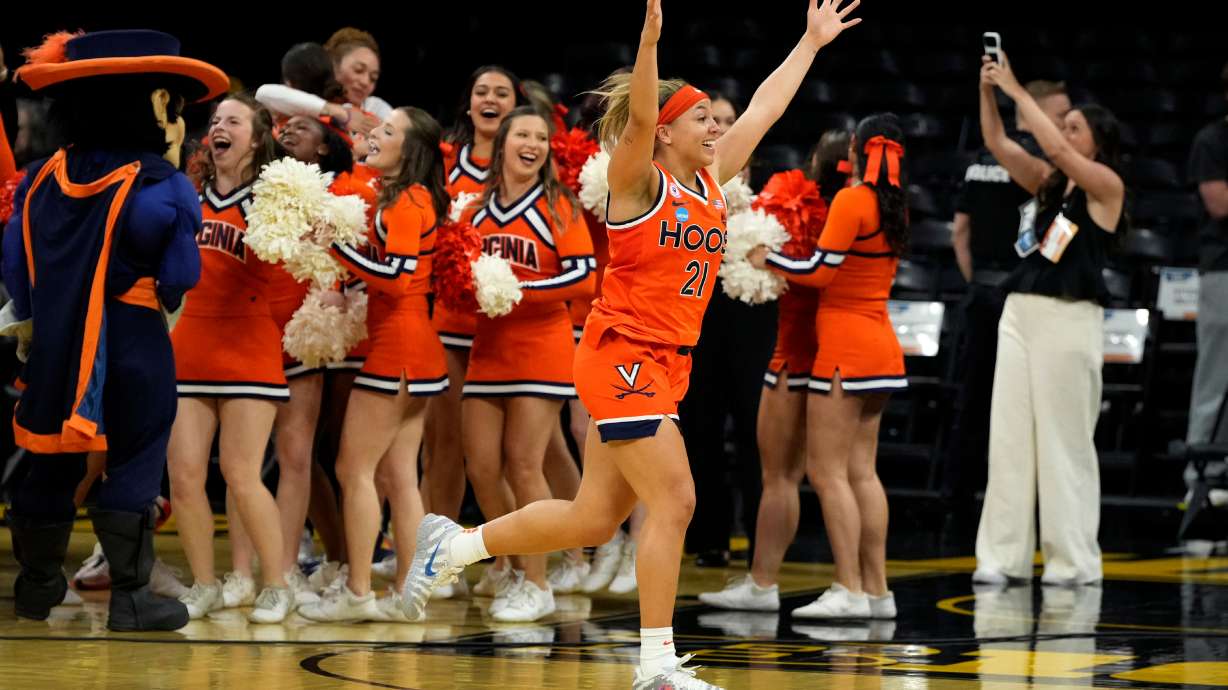 FILE - Virginia guard Kymora Johnson (21) celebrates after a second round game against Iowa in the NCAA college basketball tournament, March 23, 2026, in Iowa City, Iowa.