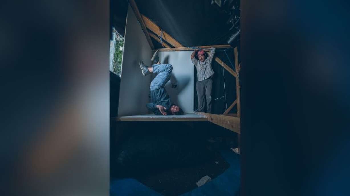 James Cutler helping his brother, Matthew Cutler, to perform a stunt during the filming of "Can I Put You On Hold?"