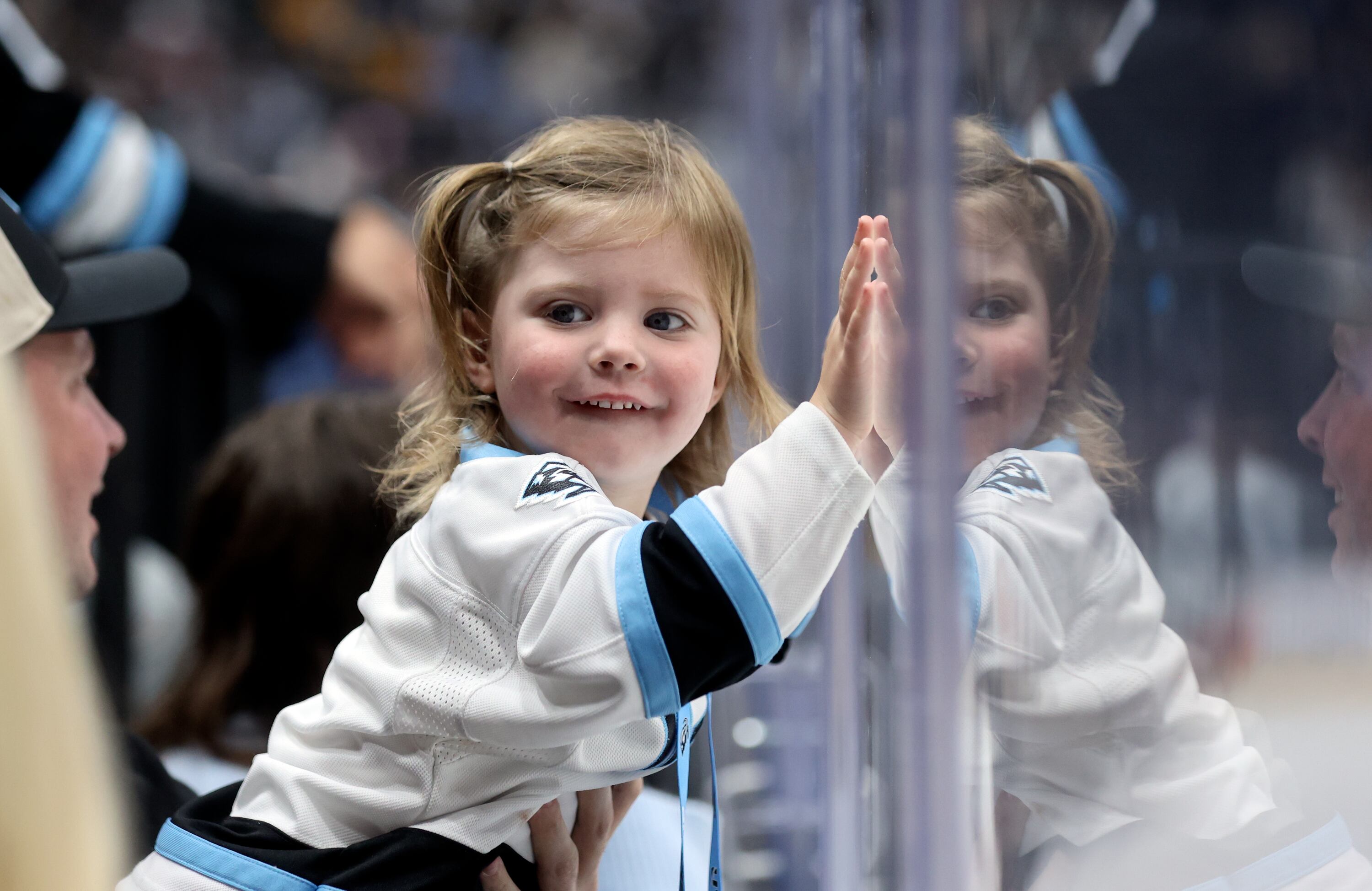 Grace Griffitts, 2, watches the Utah Mammoth play the Pittsburgh Penguins in an NHL game at the Delta Center in Salt Lake City on Oct. 19. The Mammoth won 5-4.
