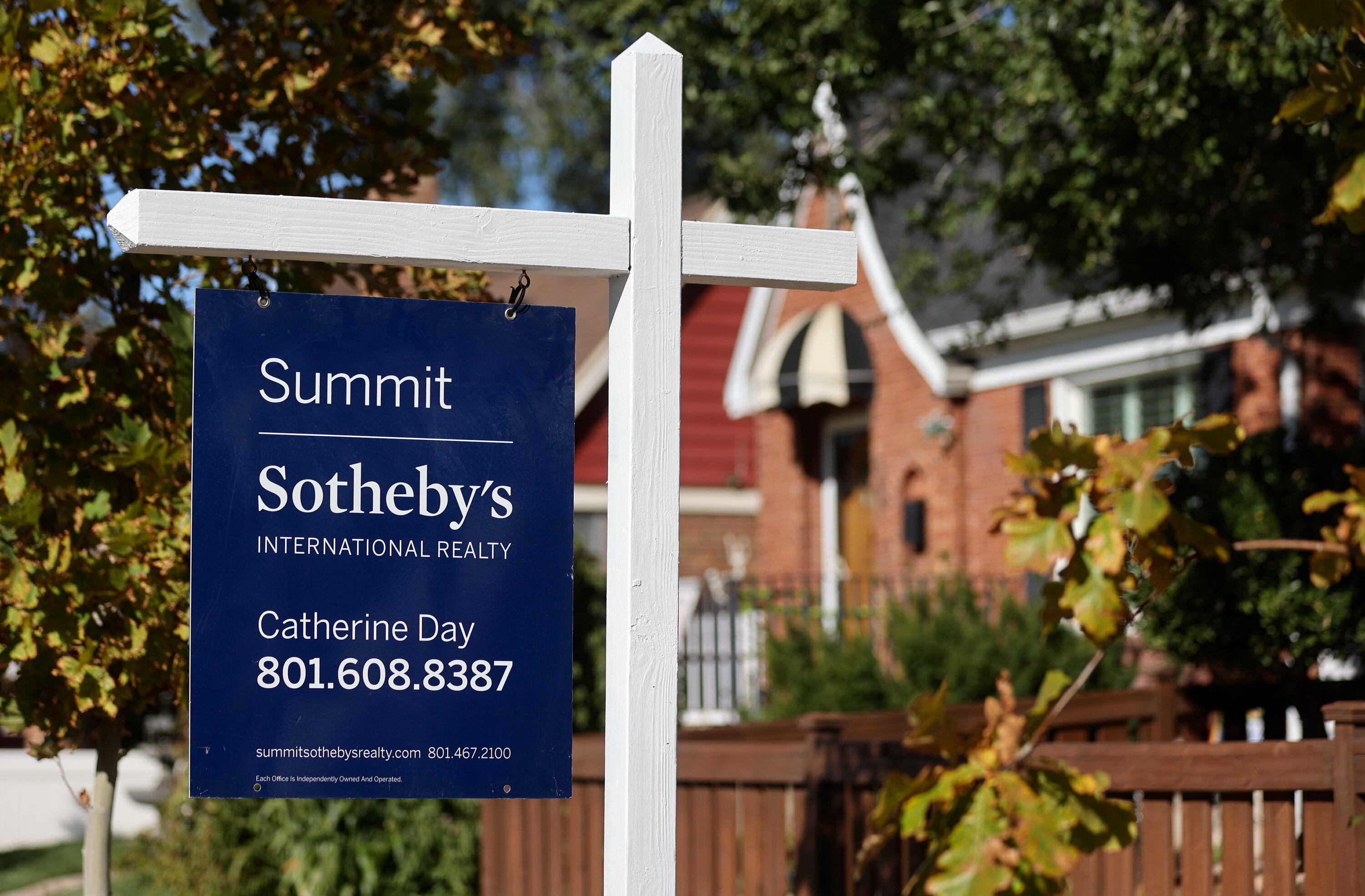 A for-sale sign is pictured outside a house in Salt Lake City on Wednesday.
