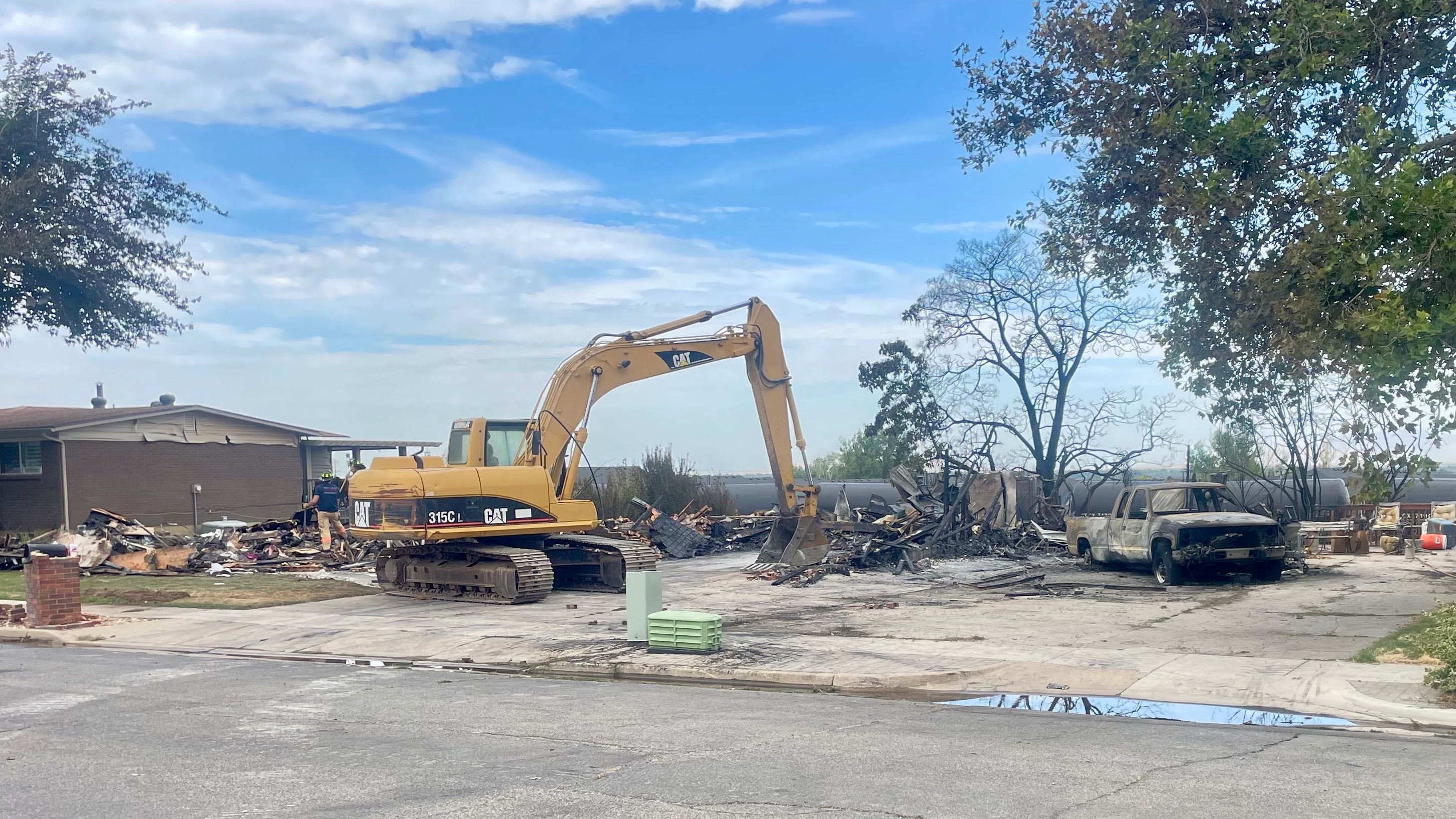 A train likely sparked a July 20 fire north of Roy, according to the probe into the incident, which doesn't delve into the fire in Roy at the same time that torched three homes. The July 21 photo shows one of the burned homes in Roy.
