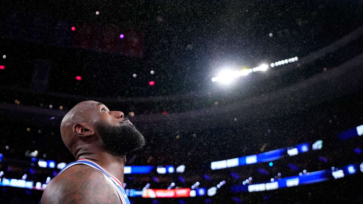 Philadelphia 76ers' LeBron James tosses chalk into the air before an NBA basketball game against the Cleveland Cavaliers Thursday, Oct. 22, 2026, in Philadelphia.