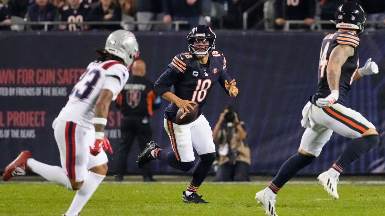 Chicago Bears quarterback Caleb Williams (18) scrambles as during the second half of an NFL football game against the New England Patriots in Chicago, Thursday, Oct. 22, 2026.