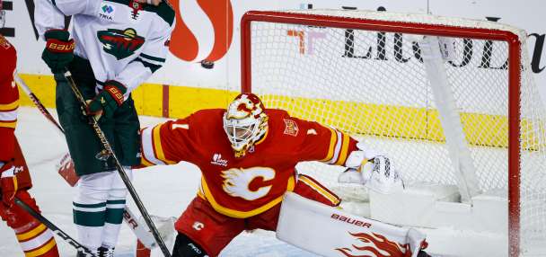 Cooley makes 36 saves in the Flames' 2-1 victory over the Wild