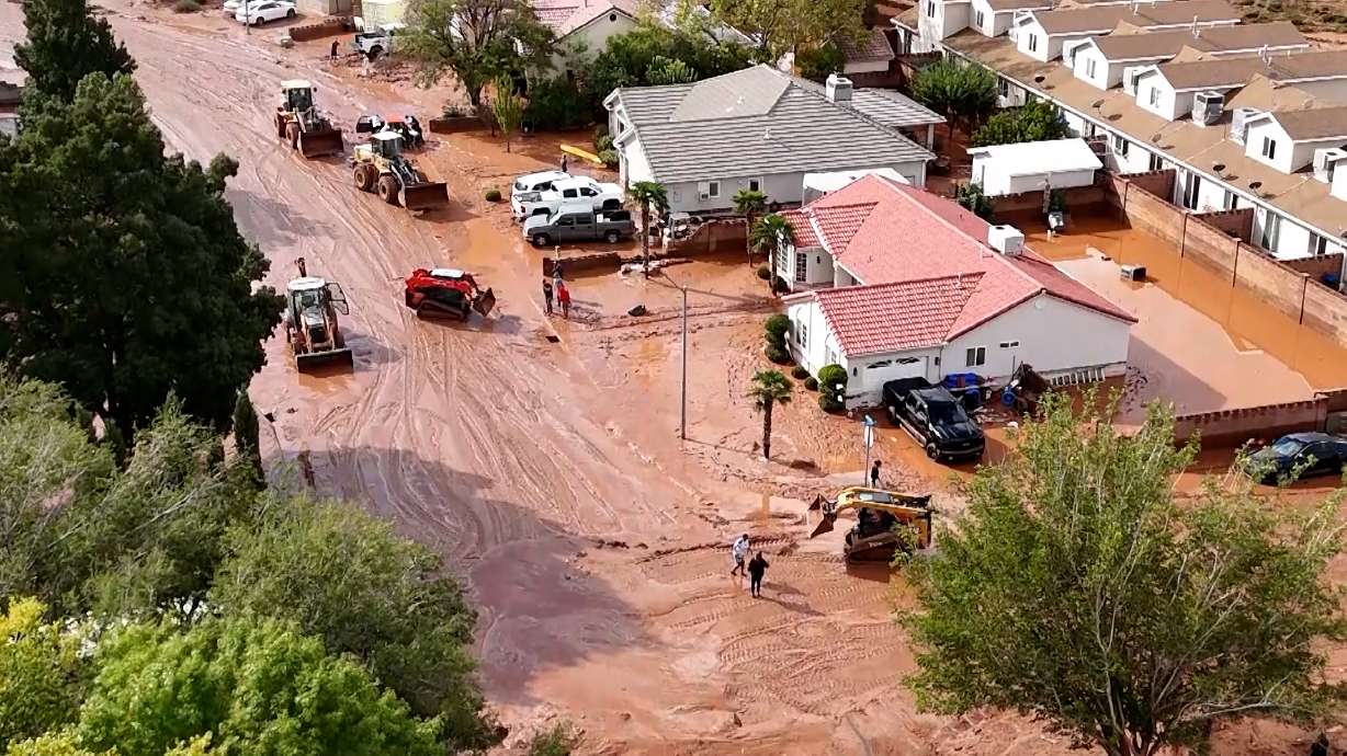 Drone video shows mud around the neighborhood just behind Pecan Park Townhomes, Thursday.
