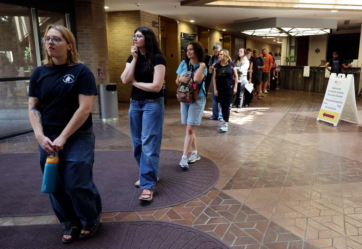 People line up to vote in the primary election at the Salt Lake County Government Center in Salt Lake City on June 23.