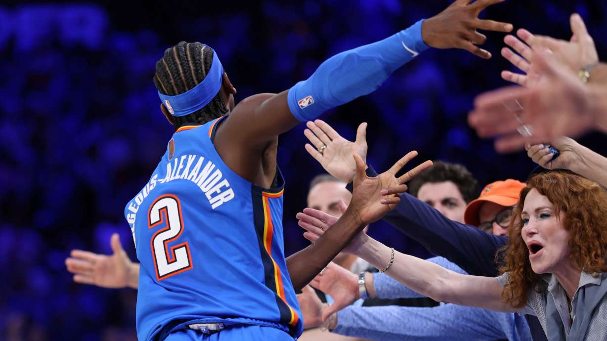 Oklahoma City Thunder guard Shai Gilgeous-Alexander celebrates with fans after making a basket during the second half of an NBA basketball game against the Denver Nuggets, Thursday, Oct. 22, 2026, in Oklahoma City.