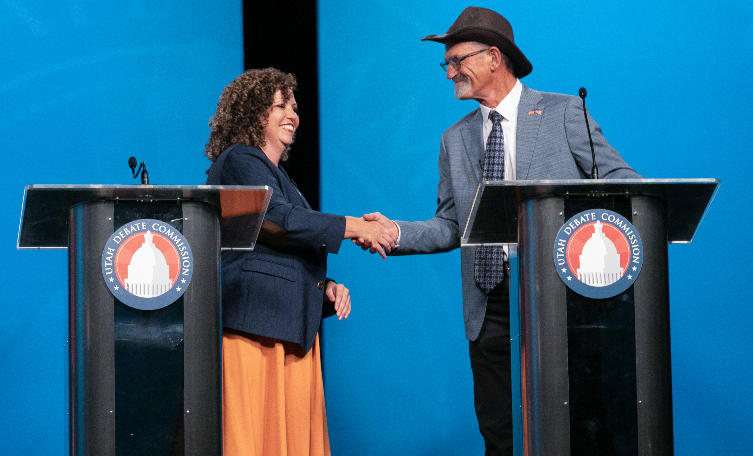 Rep. Celeste Maloy, left, and Kent Udell shake hands at the conclusion of a 3rd Congressional District debate at Utah Tech University in St. George, Friday, Oct. 2, 2026.