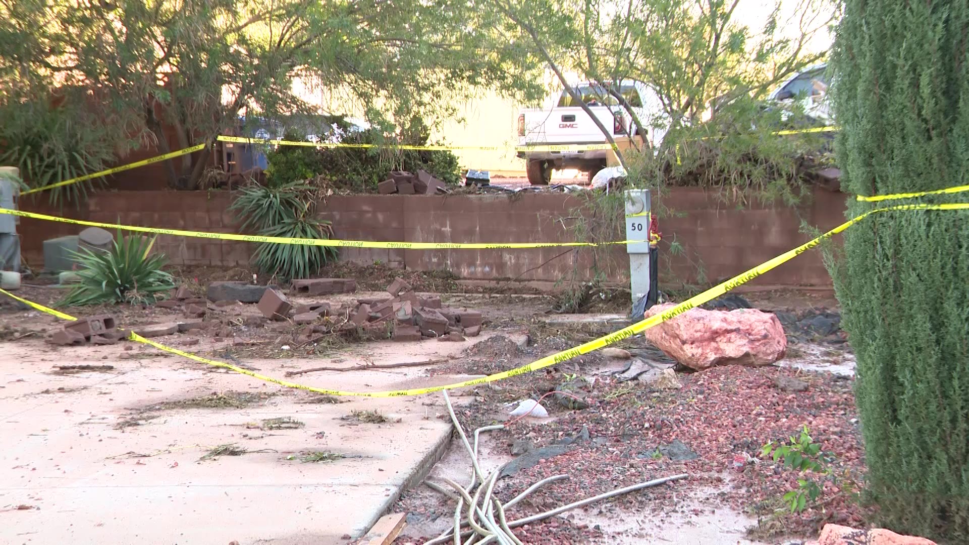 Floodwaters push shipping container through wall at Hurricane RV park